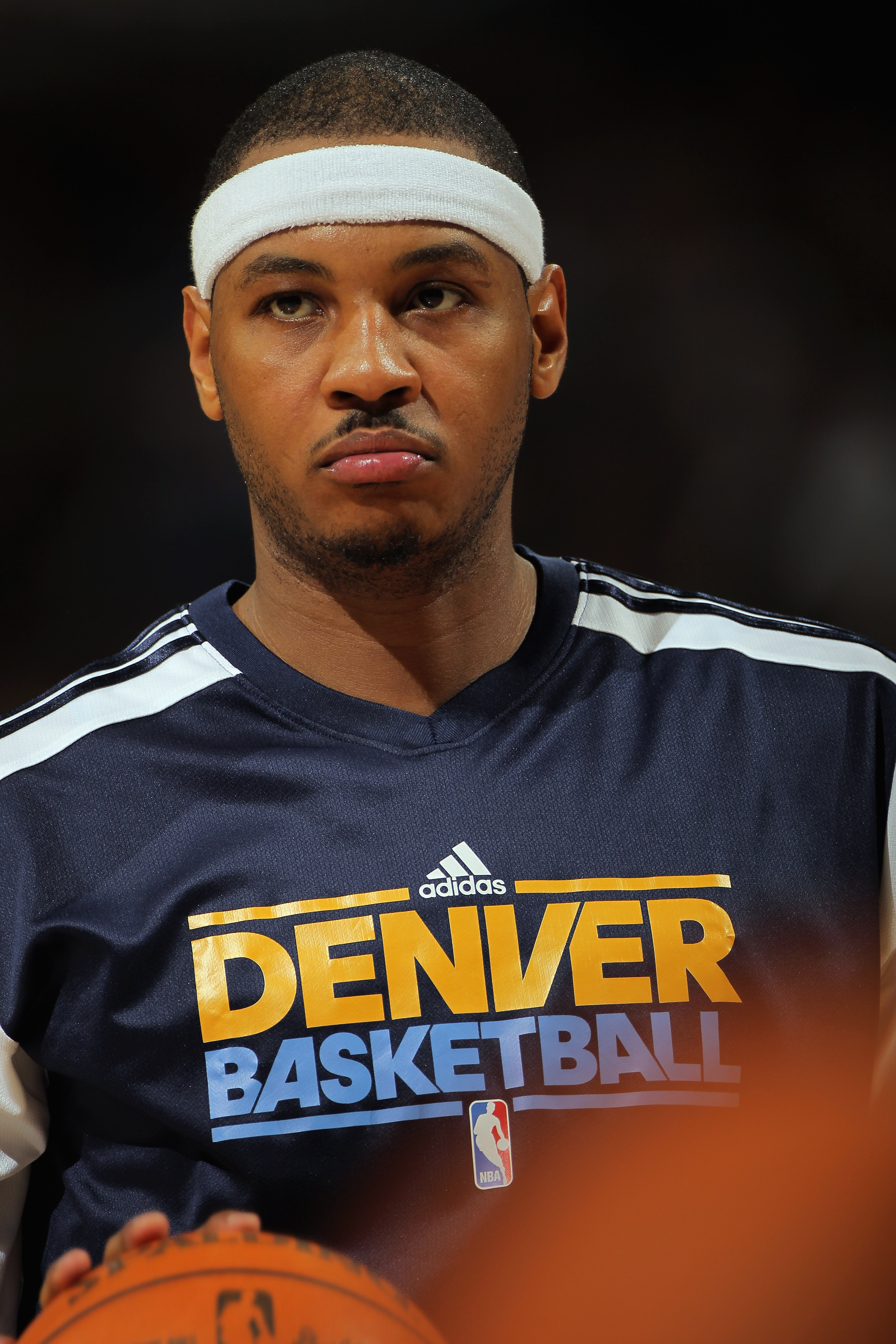 DENVER, CO - JANUARY 21:  Carmelo Anthony #15 of the Denver Nuggets looks on as he warms up for the second half against the Los Angeles Lakers at the Pepsi Center on January 21, 2011 in Denver, Colorado. The Lakers defeated the Nuggets 107-97. NOTE TO USE