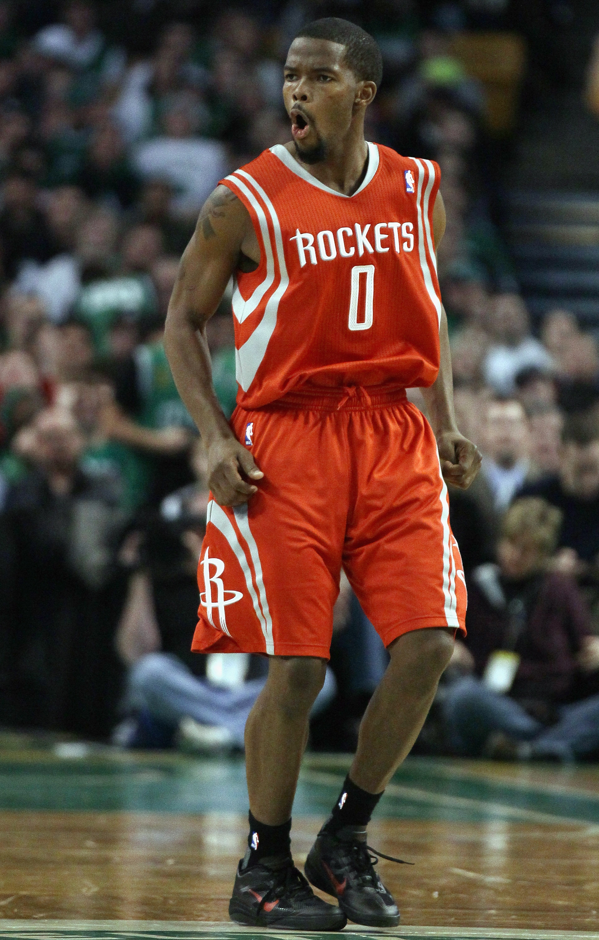 BOSTON, MA - JANUARY 10:  Aaron Brooks #0 of the Houston Rockets celebrates his three point shot in the second half against the Boston Celtics on January 10, 2011 at the TD Garden in Boston, Massachusetts.  The Rockets defeated the Celtics 108-102. NOTE T