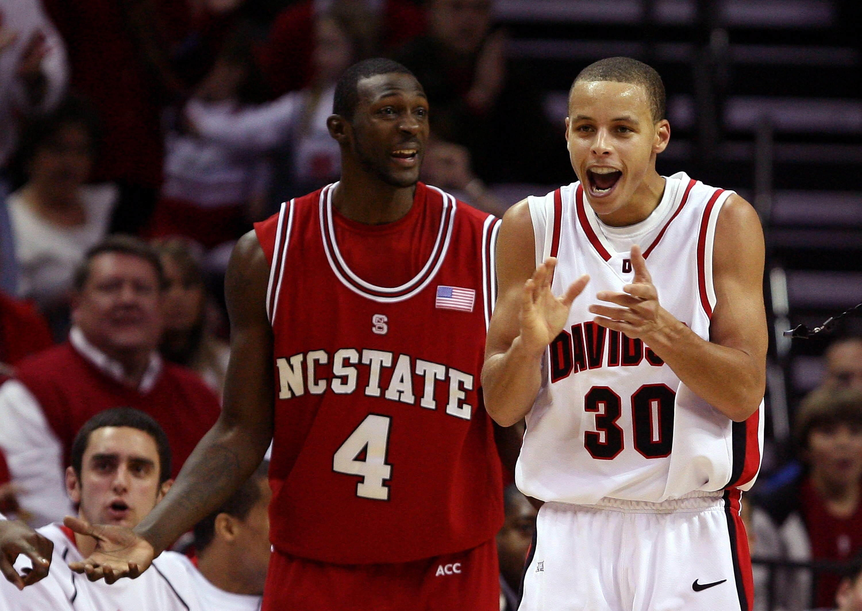 CHARLOTTE, NC - DECEMBER 06:  Stephen Curry #30 of the Davidson Wildcats reacts to a call with Courtney Fells #4 of the North Carolina State Wolfpack during their game at Time Warner Cable Arena on December 6, 2008 in Charlotte, North Carolina.  (Photo by