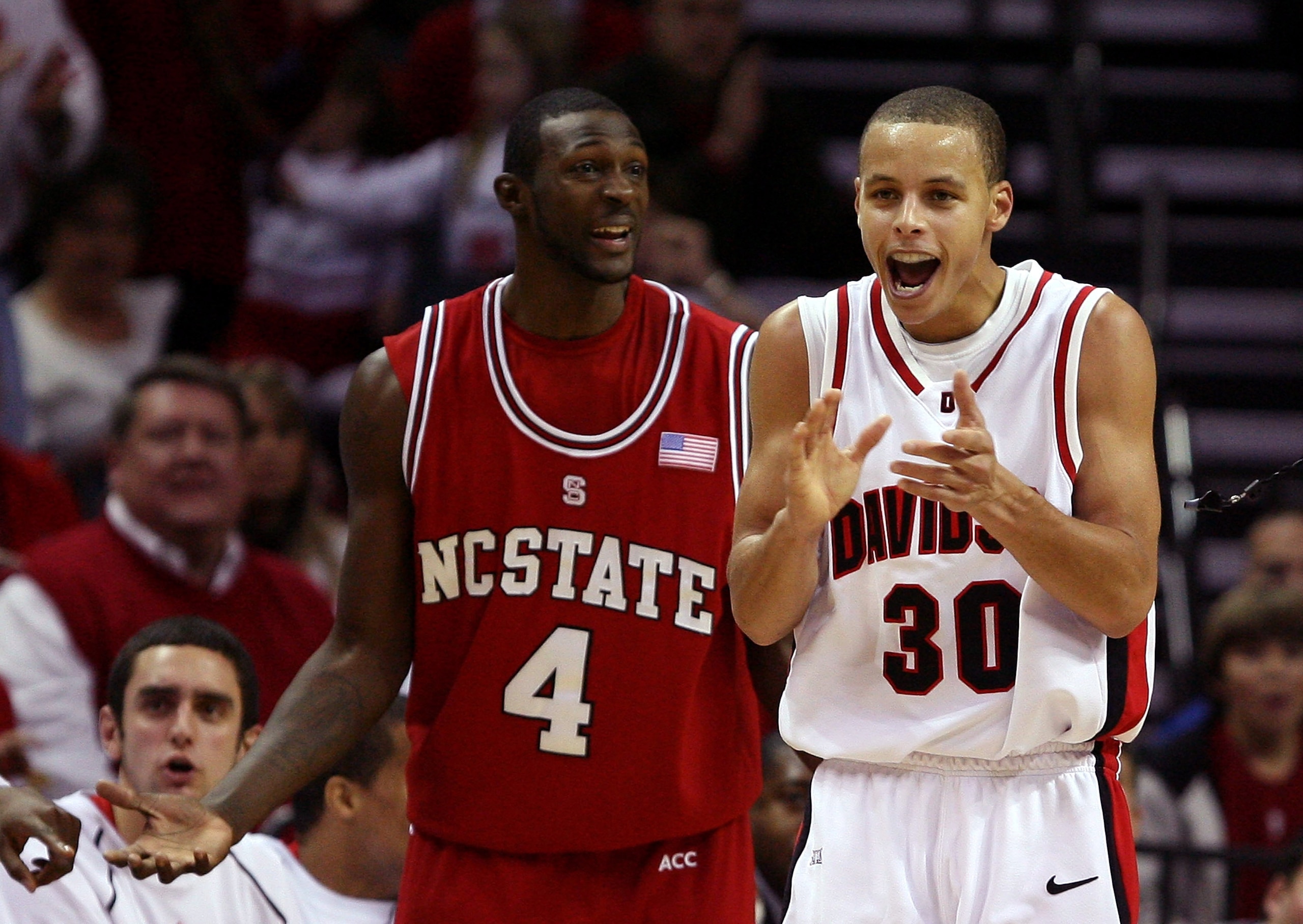 CHARLOTTE, NC - DECEMBER 06:  Stephen Curry #30 of the Davidson Wildcats reacts to a call with Courtney Fells #4 of the North Carolina State Wolfpack during their game at Time Warner Cable Arena on December 6, 2008 in Charlotte, North Carolina.  (Photo by