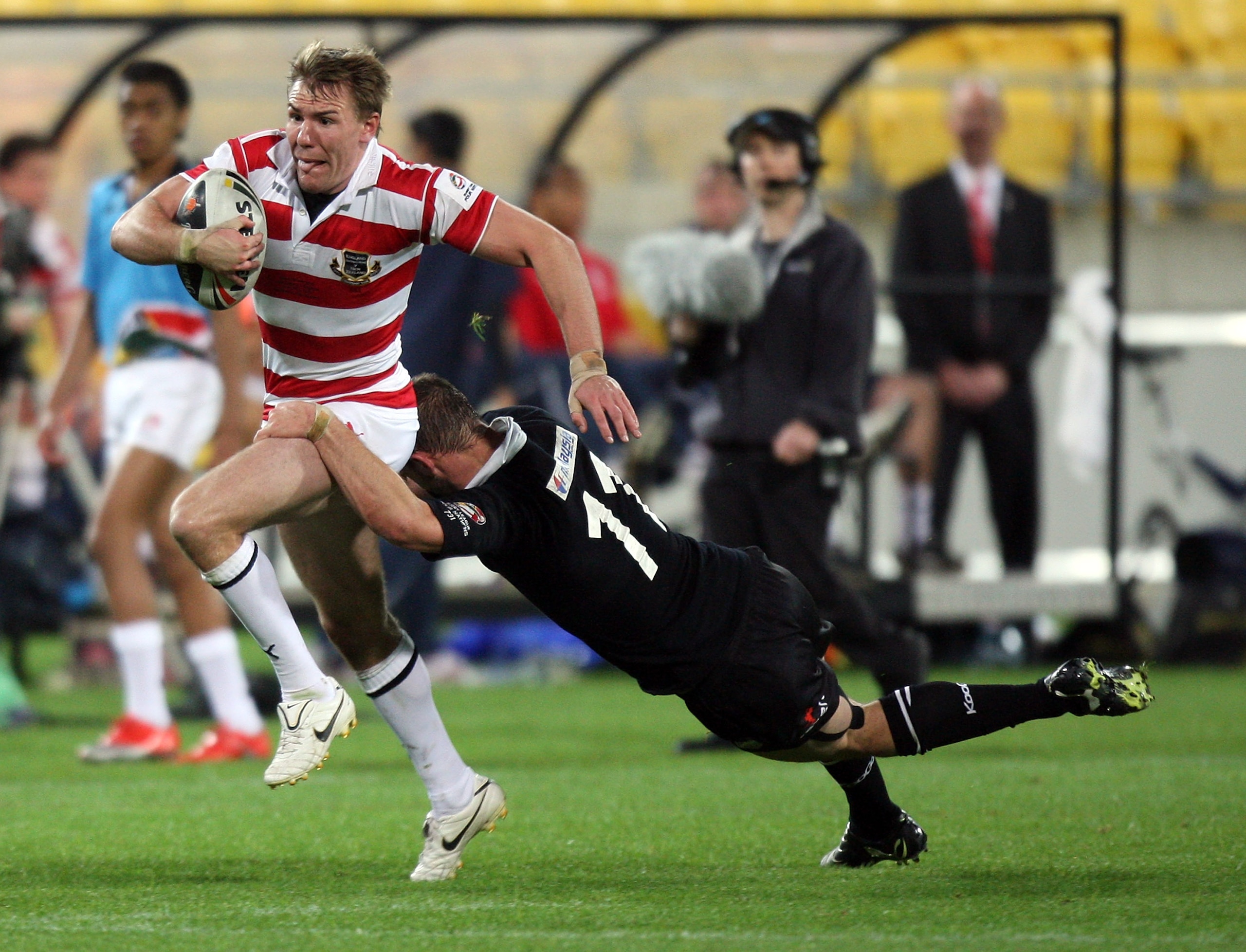 WELLINGTON, NEW ZEALAND - OCTOBER 23: Michael Shenton of England is tackled by Simon Mannering of the Kiwis during the Four Nations match between the New Zealand Kiwis and England at Westpac Stadium on October 23, 2010 in Wellington, New Zealand.  (Photo