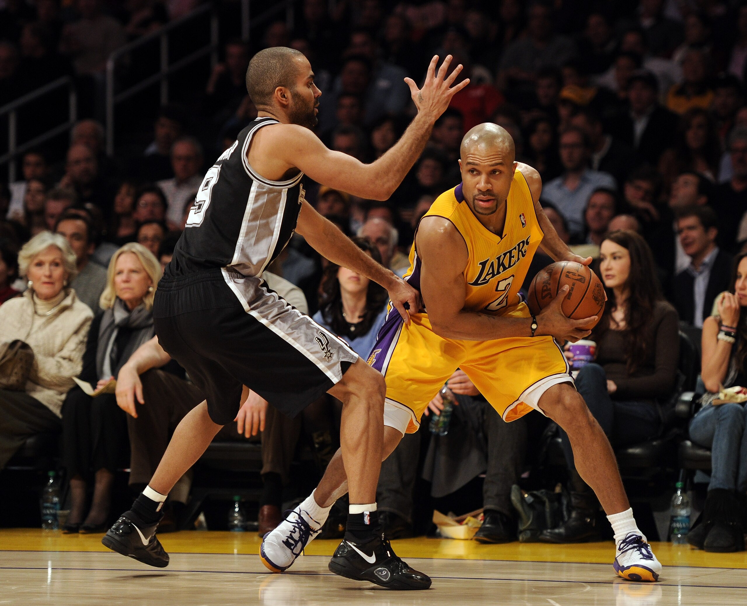 LOS ANGELES, CA - FEBRUARY 03:  Derek Fisher #2 of the Los Angeles Lakers is guarded by Tony Parker #9 of the San Antonio Spurs at Staples Center on February 3, 2011 in Los Angeles, California.  NOTE TO USER: User expressly acknowledges and agrees that, b