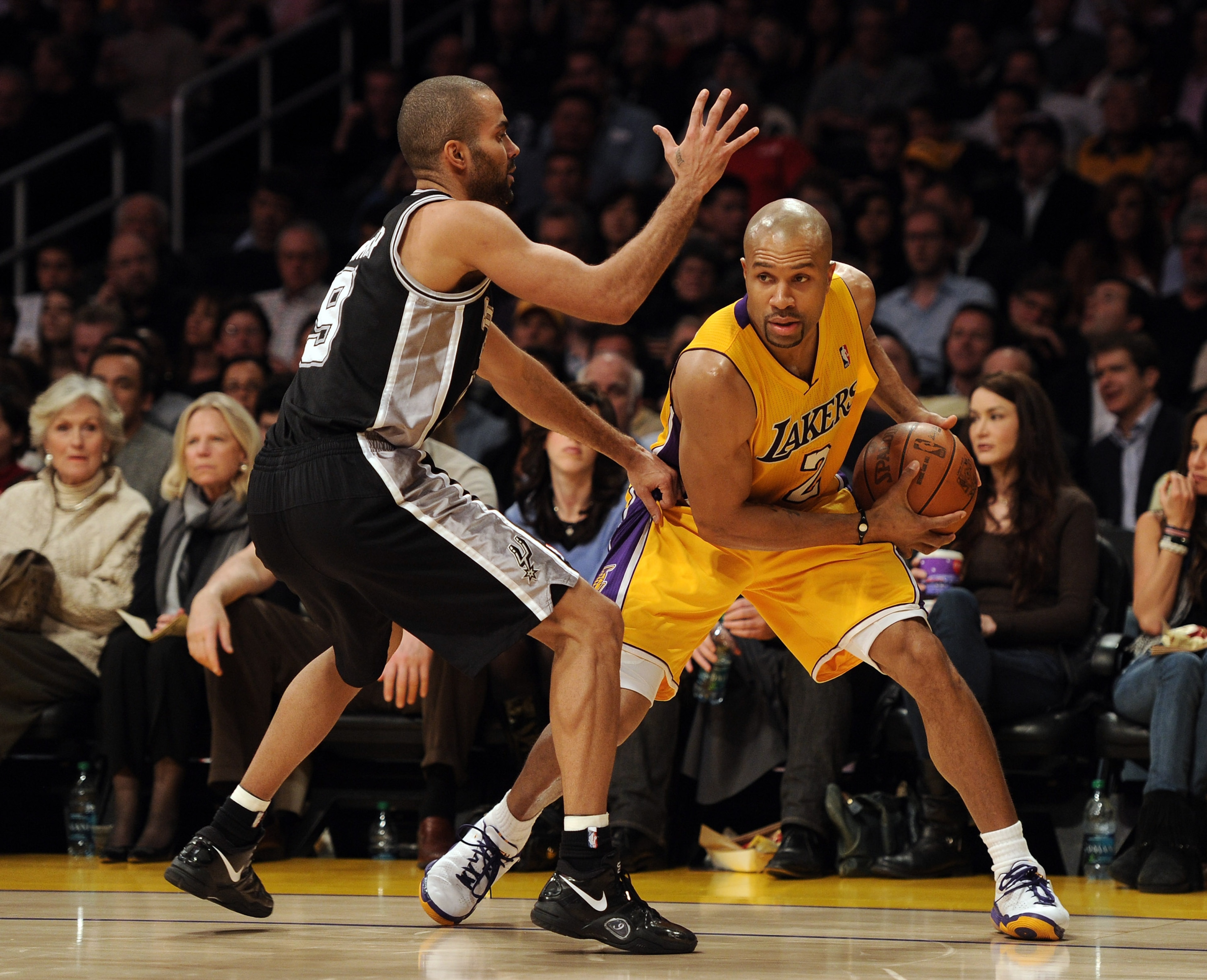 LOS ANGELES, CA - FEBRUARY 03:  Derek Fisher #2 of the Los Angeles Lakers is guarded by Tony Parker #9 of the San Antonio Spurs at Staples Center on February 3, 2011 in Los Angeles, California.  NOTE TO USER: User expressly acknowledges and agrees that, b