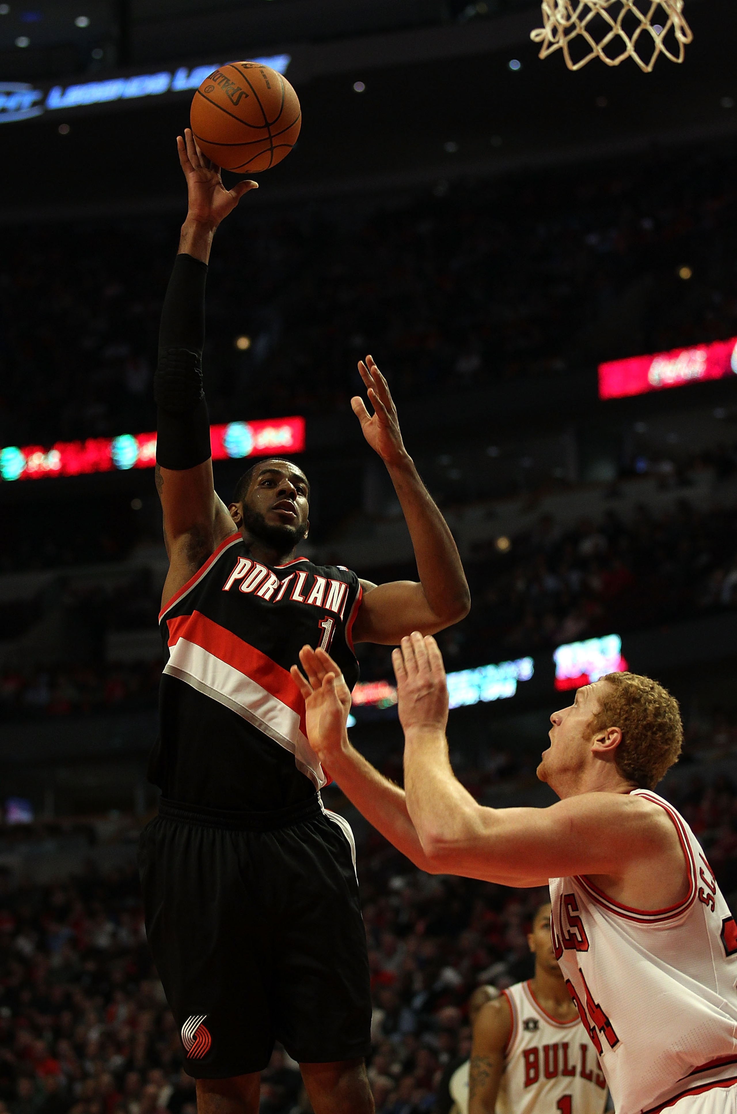 CHICAGO - NOVEMBER 01: LaMarcus Aldridge #12 of the Portland Trail Blazers puts up a shot over Brian Scalabrine #24 of the Chicago Bulls at the United Center on November 1, 2010 in Chicago, Illinois. NOTE TO USER: User expressly acknowledges and agrees th