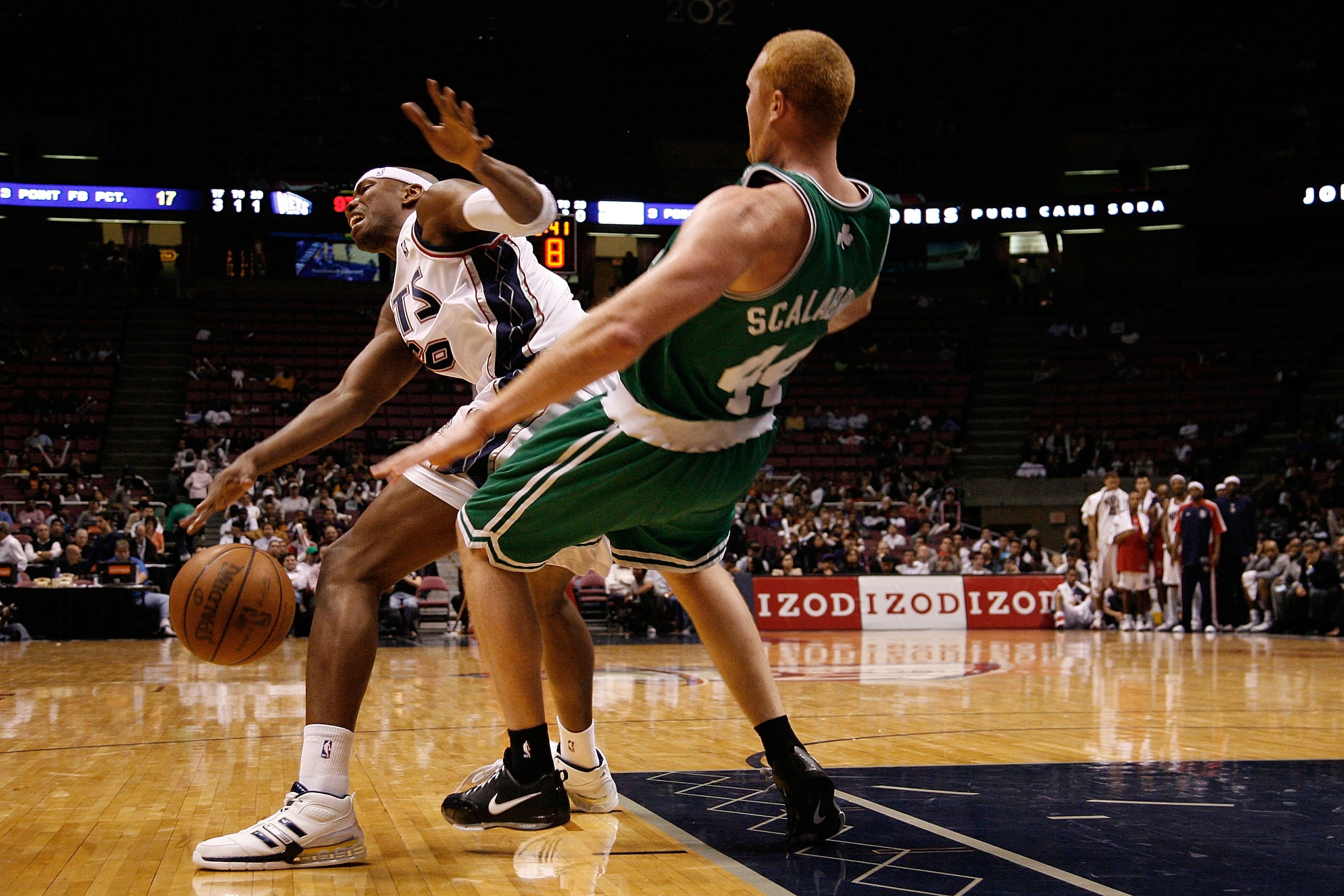 EAST RUTHERFORD, NJ - OCTOBER 16: Stromile Swift #6 (L) of the New Jersey Nets knocks Brian Scalabrine #44 of the Boston Celtics off balance during the second half of a pre-season game at the IZOD Center on October 16, 2008 in East Rutherford, New Jersey.