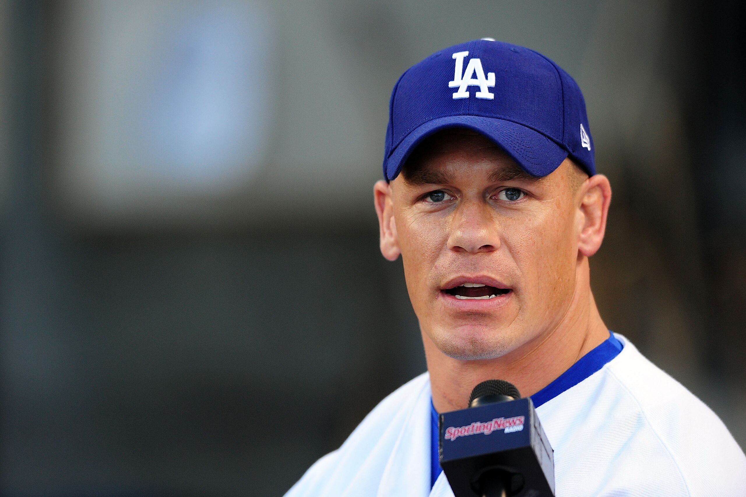 LOS ANGELES, CA - AUGUST 20: WWE Superstar John Cena throws the ceremonial first pitch for the Los Angeles Dodgers as they play the Chicago Cubs on August 20, 2009 at Dodger Stadium in Los Angeles, California. (Photo by Jacob de Golish/Getty Images) LOS ANGELES, CA - AUGUST 20: WWE Superstar John Cena throws the ceremonial first pitch for the Los Angeles Dodgers as they play the Chicago Cubs on August 20, 2009 at Dodger Stadium in Los Angeles, California. (Photo by Jacob de Golish/Getty Images)