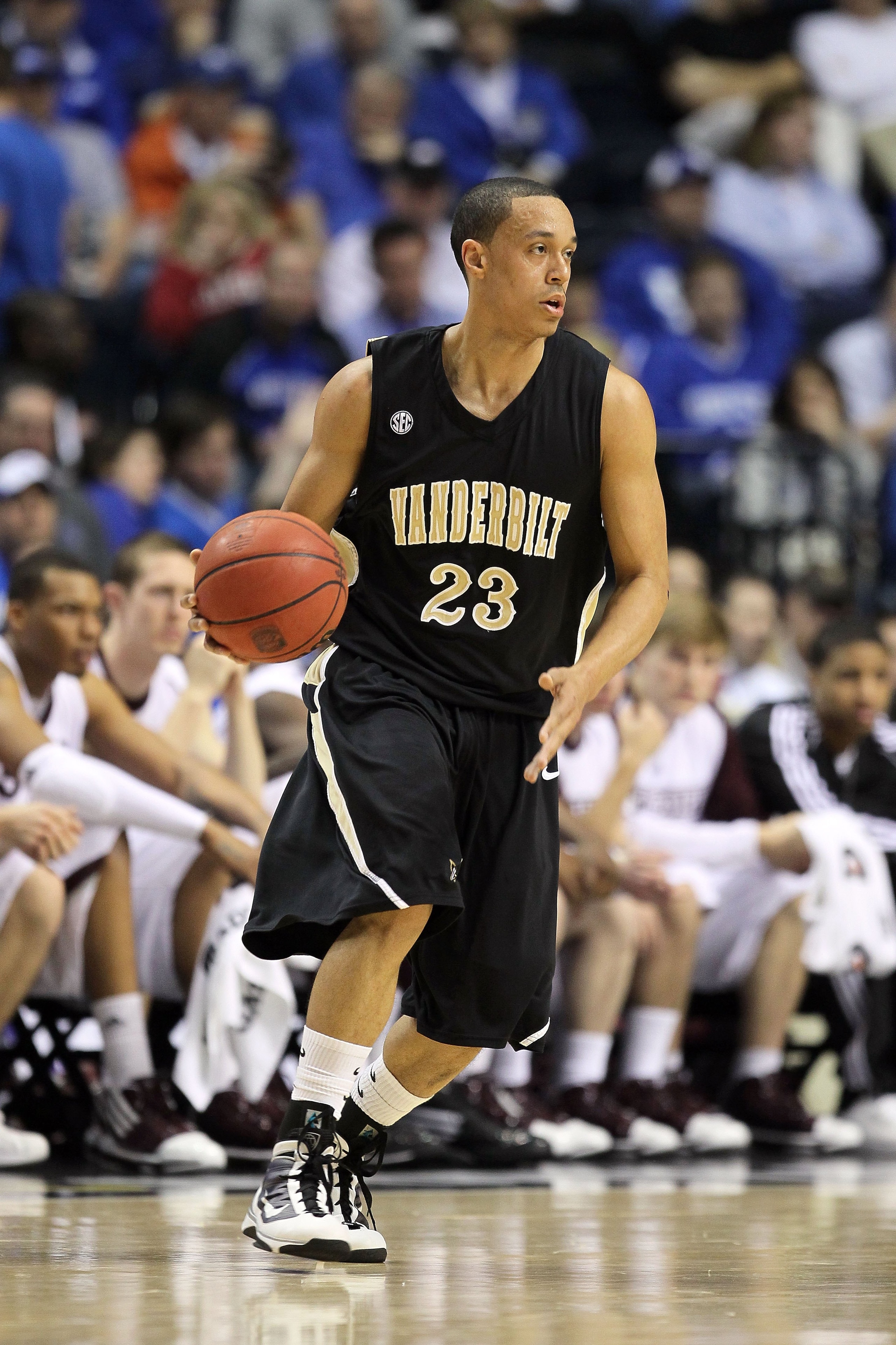 NASHVILLE, TN - MARCH 13:  John Jenkins #23 of the Vanderbilt Commodores handles the ball against the Mississippi State Bulldogs during the semifinals of the SEC Men's Basketball Tournament at the Bridgestone Arena on March 13, 2010 in Nashville, Tennesse