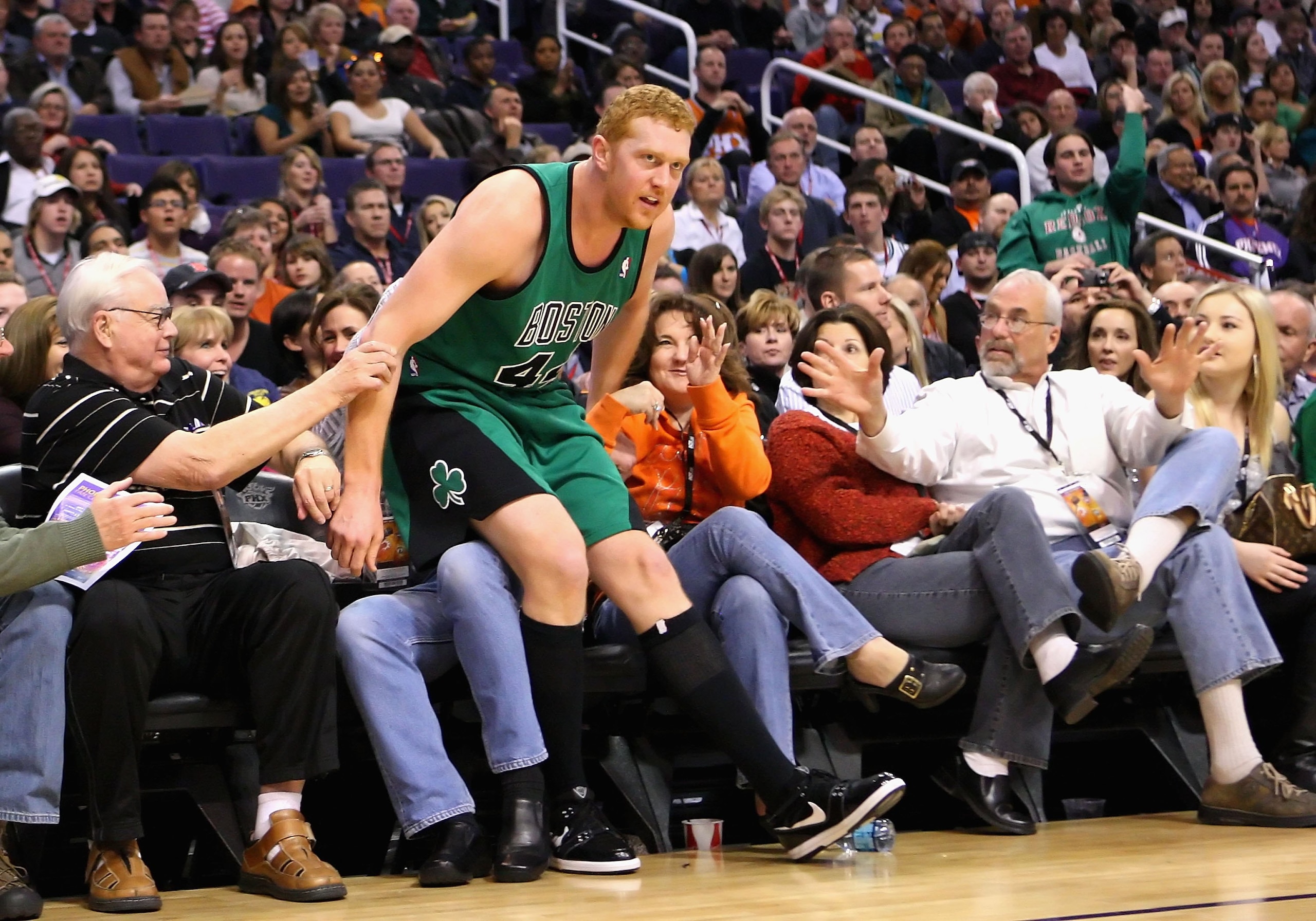 PHOENIX - DECEMBER 30:  Brian Scalabrine #44 of the Boston Celtics falls into the crowd during the NBA game against the Phoenix Suns at US Airways Center on December 30, 2009 in Phoenix, Arizona. The Suns defeated the Celtics 116-98.  NOTE TO USER: User e