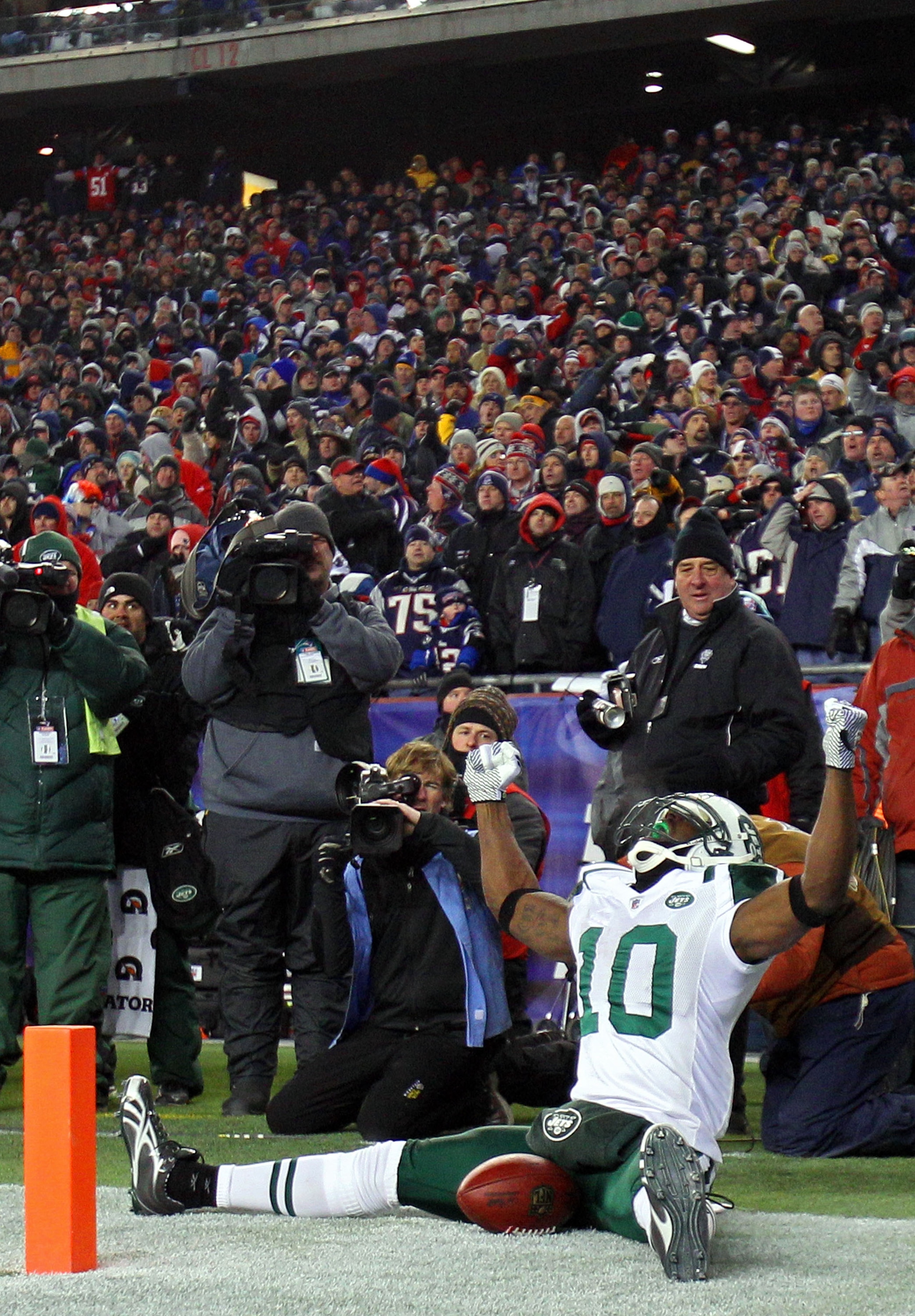 FOXBORO, MA - JANUARY 16:  Santonio Holmes #10 of the New York Jets celebrates his fourth quarter touchdown against the New England Patriots during their 2011 AFC divisional playoff game at Gillette Stadium on January 16, 2011 in Foxboro, Massachusetts.