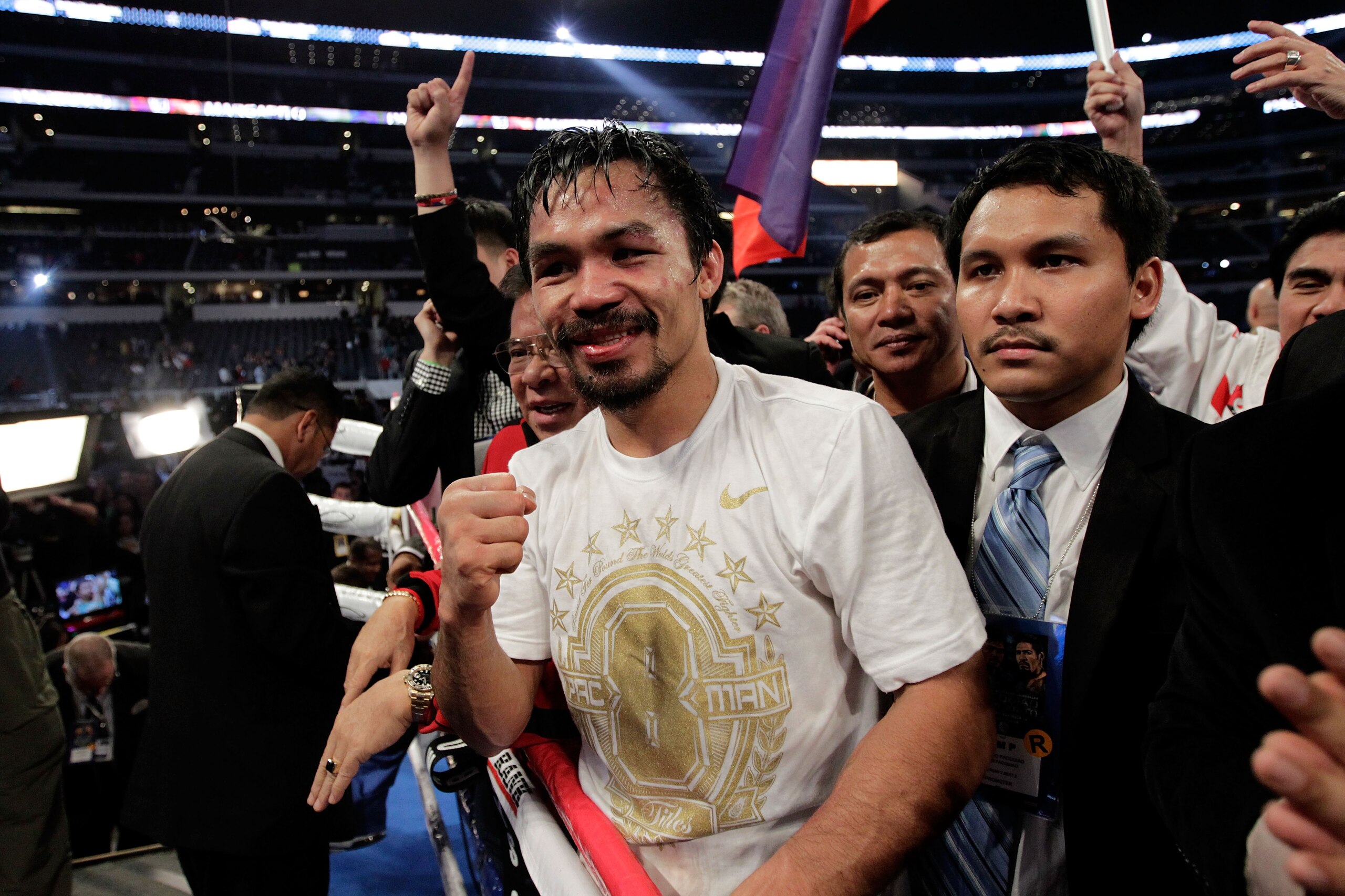 ARLINGTON, TX - NOVEMBER 13: Manny Pacquiao (white trunks) of the Philippines celebrates after he was declared the winner by a unanimous decision against Antonio Margarito (black trunks) of Mexico during their WBC World Super Welterweight Title bout at C ARLINGTON, TX - NOVEMBER 13: Manny Pacquiao (white trunks) of the Philippines celebrates after he was declared the winner by a unanimous decision against Antonio Margarito (black trunks) of Mexico during their WBC World Super Welterweight Title bout at C