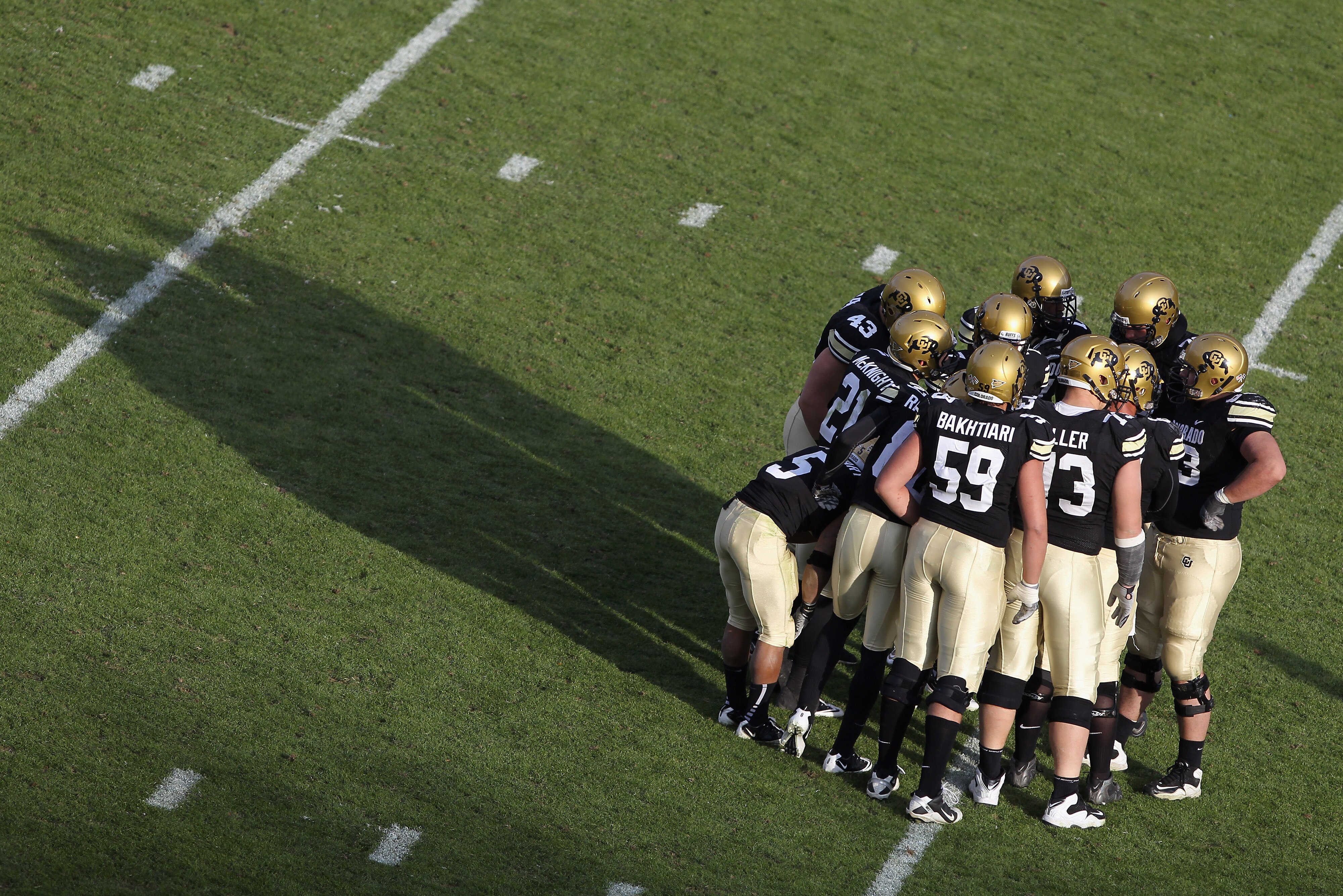 BOULDER, CO - NOVEMBER 20:  The Colorado Buffaloes offenses huddles up against the Kansas State Wildcats at Folsom Field on November 20, 2010 in Boulder, Colorado. Colorado defeated Kansas State 44-36.  (Photo by Doug Pensinger/Getty Images)