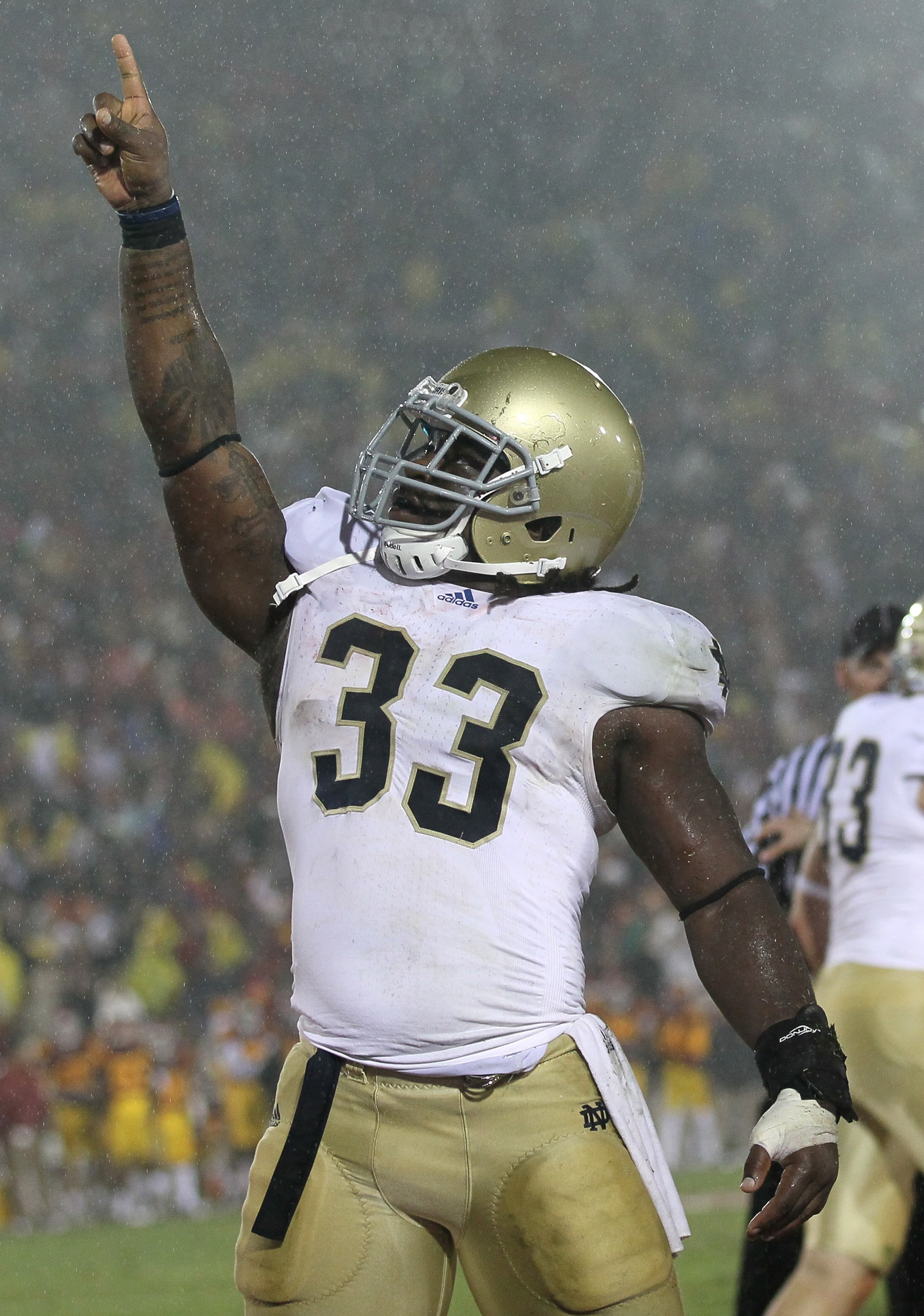 LOS ANGELES - NOVEMBER 27: Running back Robert Hughes #33 of the Notre Dame Fighting Irish celebrates after scoring the eventual winning touchdown in the fourth quarter against the USC Trojans at the Los Angeles Memorial Coliseum on November 27, 2010 in LOS ANGELES - NOVEMBER 27: Running back Robert Hughes #33 of the Notre Dame Fighting Irish celebrates after scoring the eventual winning touchdown in the fourth quarter against the USC Trojans at the Los Angeles Memorial Coliseum on November 27, 2010 in