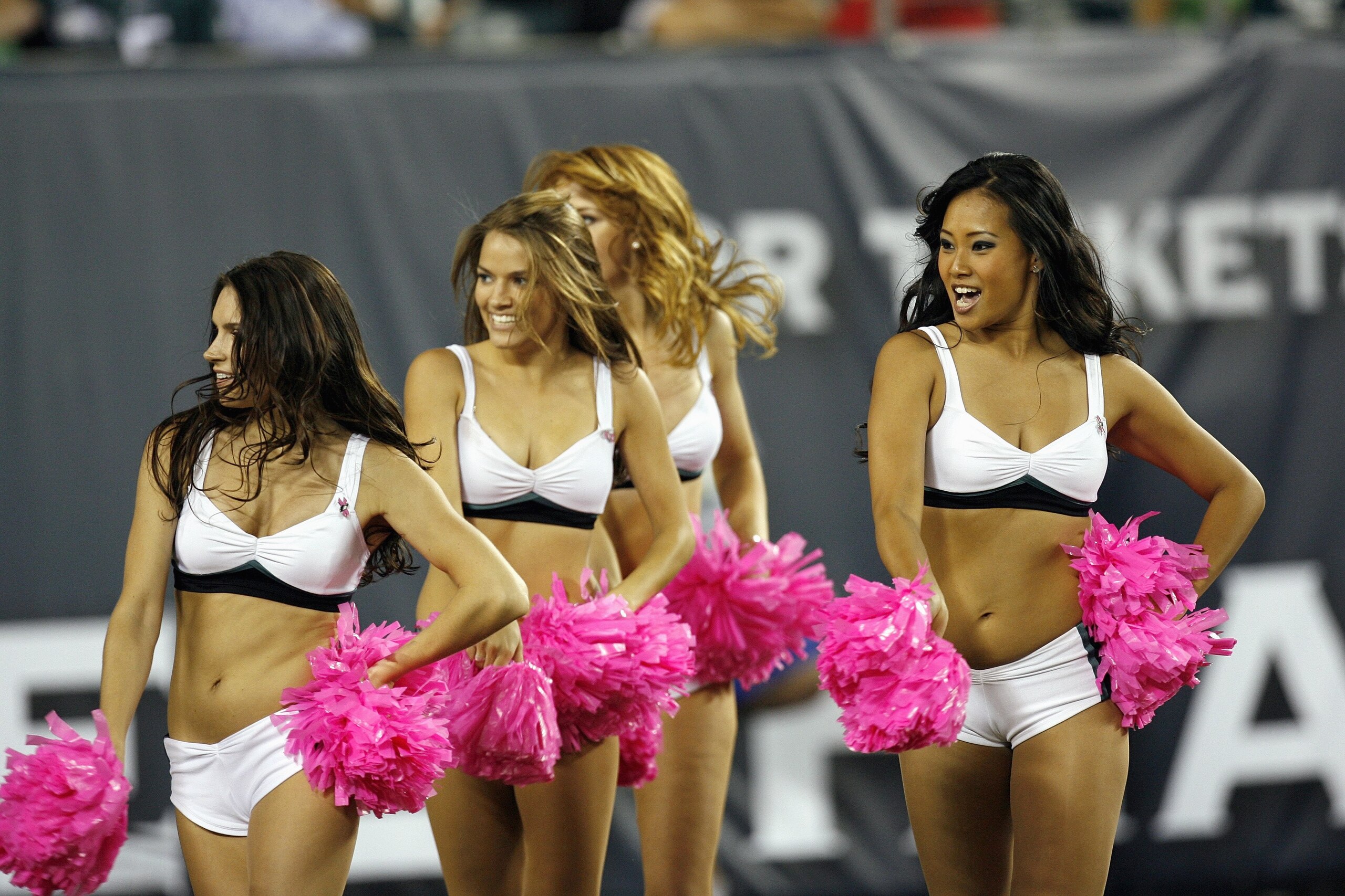 PHILADELPHIA - OCTOBER 21: The Philadelphia Eagles cheerleading squad performs with pink pom-poms in support of the fight against breast cancer during the second half of the Eagles 19-16 loss to the Chicago Bears at Lincoln Financial Field October 21, 200