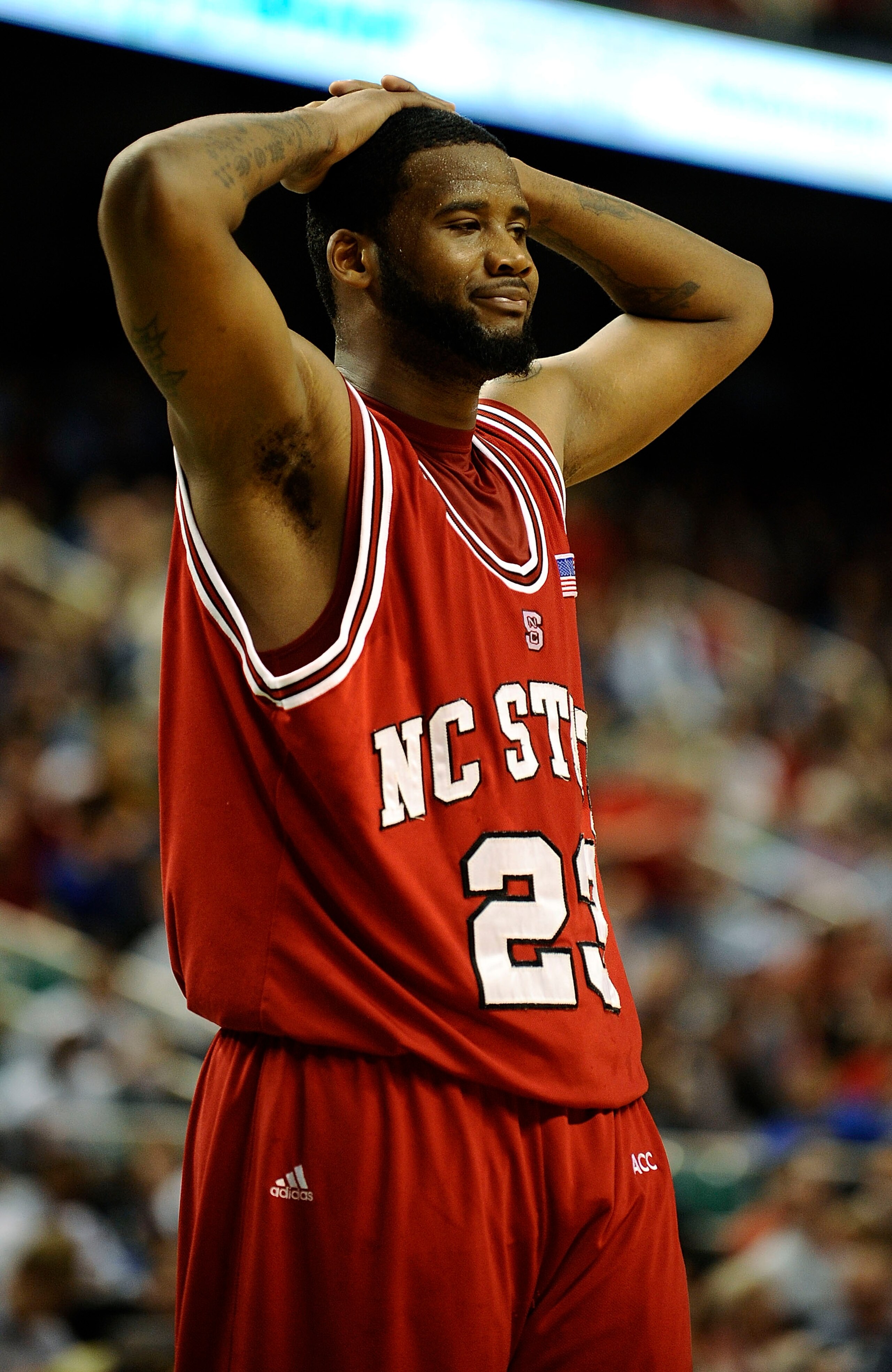 GREENSBORO, NC - MARCH 13:  Tracy Smith #23 of the North Carolina State Wolfpack reacts in a semifinal game against the Georgia Tech Yellow Jackets in the 2010 ACC Men's Basketball Tournament at the Greensboro Coliseum on on March 13, 2010 in Greensboro,
