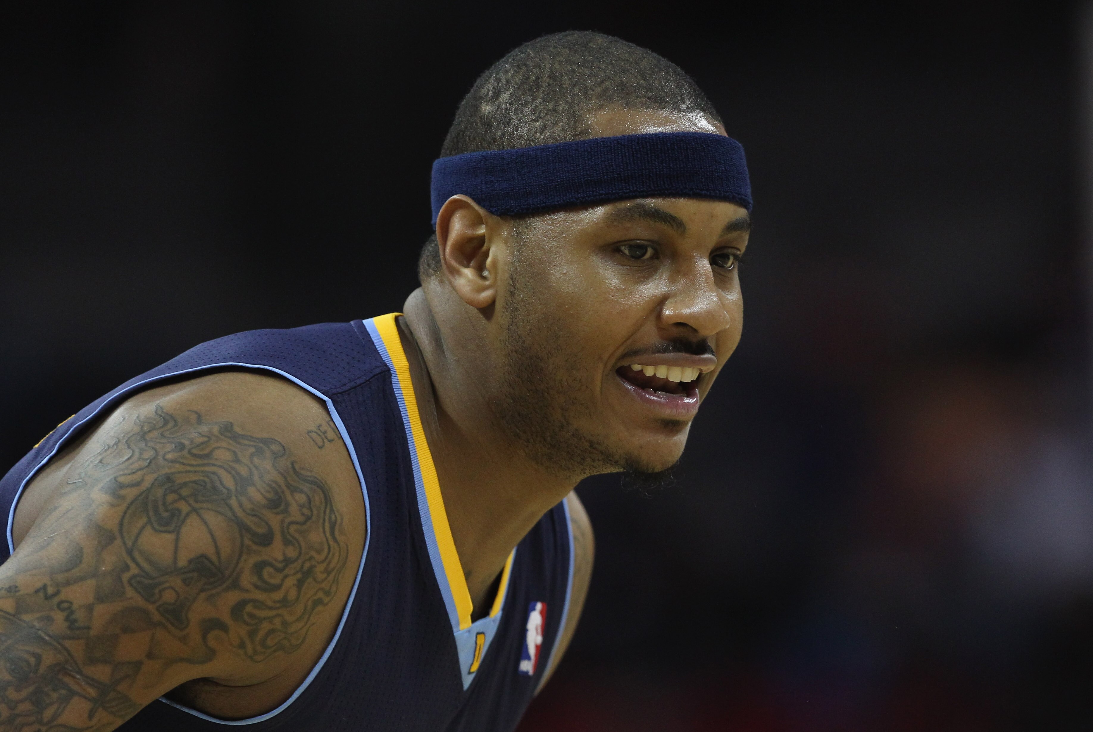 CHARLOTTE, NC - DECEMBER 07:  Carmelo Anthony #15 of the Denver Nuggets watches on against the Charlotte Bobcats during their game at Time Warner Cable Arena on December 7, 2010 in Charlotte, North Carolina.  NOTE TO USER: User expressly acknowledges and 