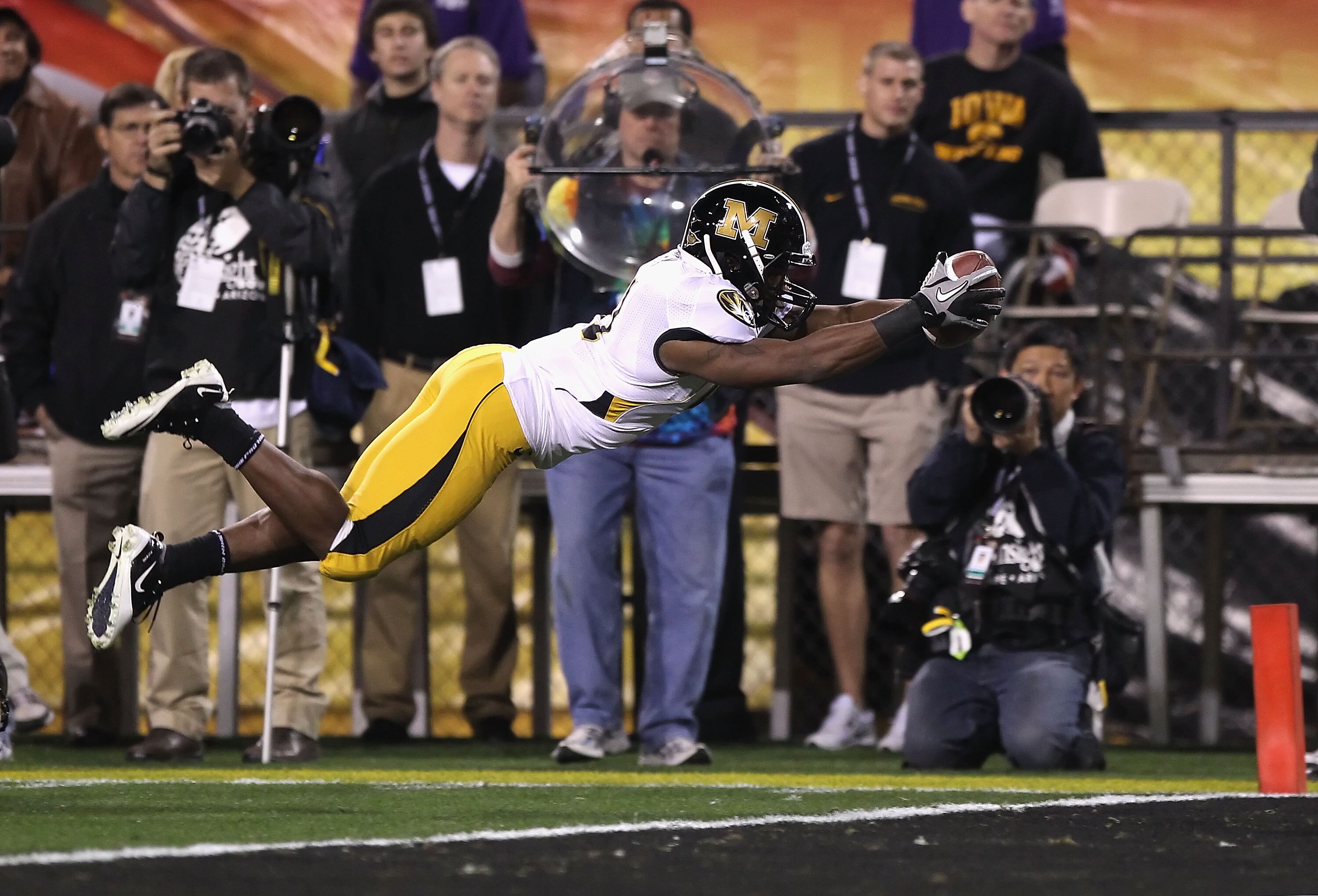 TEMPE, AZ - DECEMBER 28:  Runningback Henry Josey #41 of the Missouri Tigers dives into the endzone to score on a 10 yard rushing touchdown against the Iowa Hawkeyes during the second quarter of the Insight Bowl at Sun Devil Stadium on December 28, 2010 i