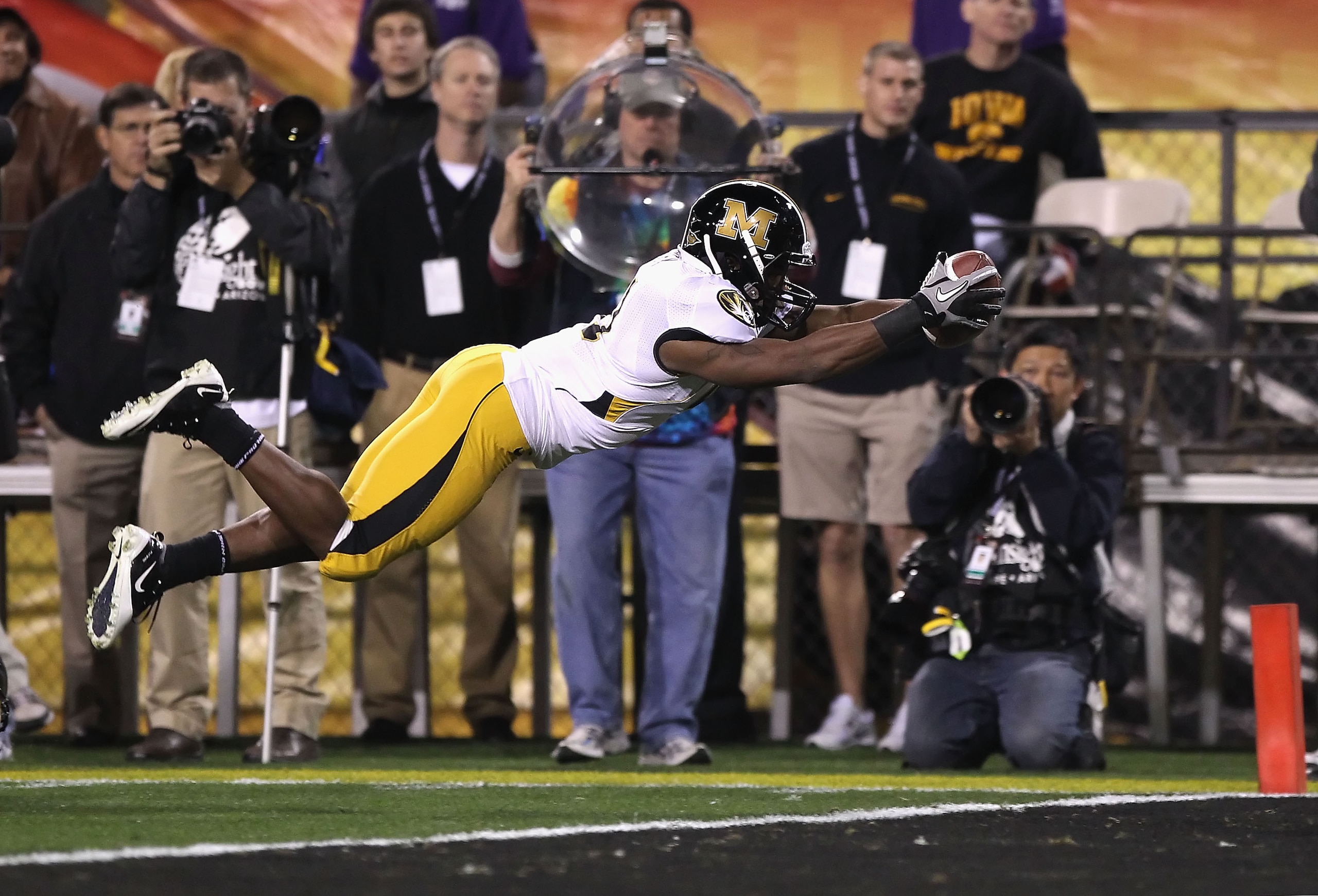TEMPE, AZ - DECEMBER 28:  Runningback Henry Josey #41 of the Missouri Tigers dives into the endzone to score on a 10 yard rushing touchdown against the Iowa Hawkeyes during the second quarter of the Insight Bowl at Sun Devil Stadium on December 28, 2010 i