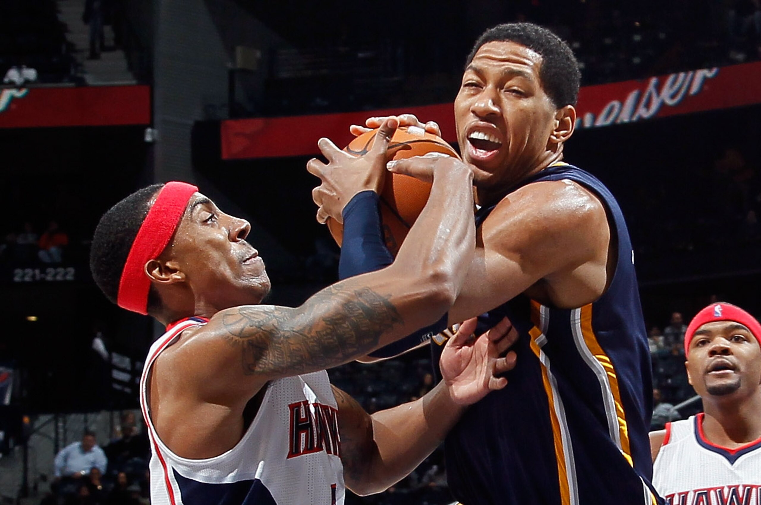 ATLANTA, GA - DECEMBER 11:  Jeff Teague #0 of the Atlanta Hawks reaches for a steal against Danny Granger #33 of the Indiana Pacers at Philips Arena on December 11, 2010 in Atlanta, Georgia.  NOTE TO USER: User expressly acknowledges and agrees that, by d