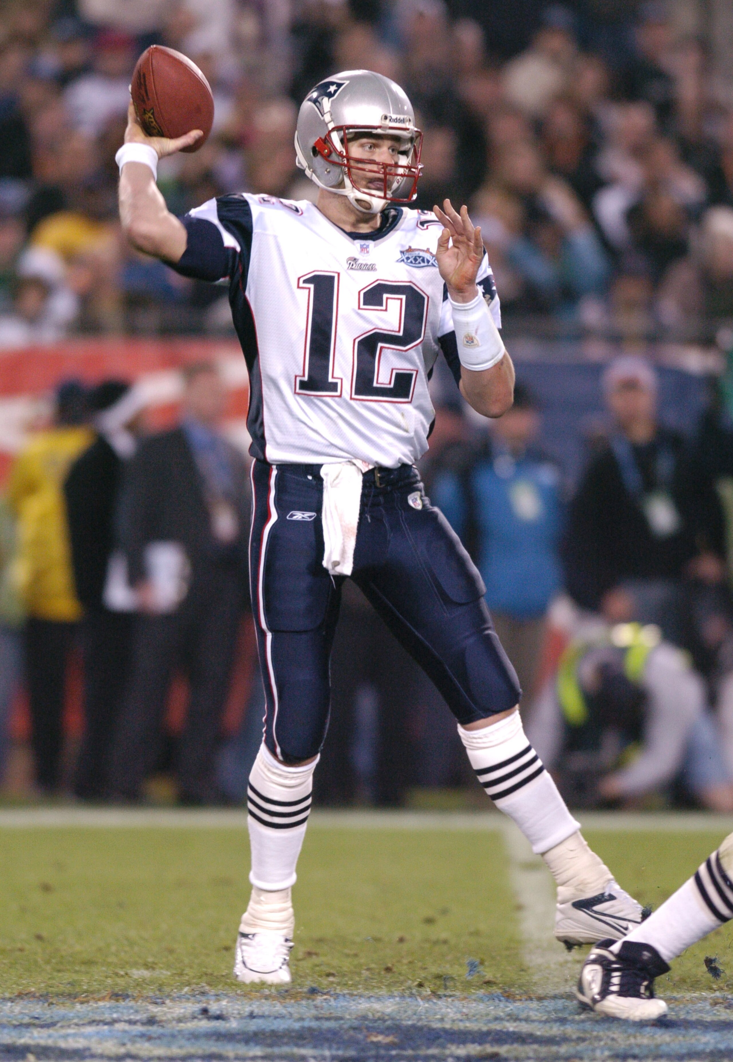 New England Patriots QB Tom Brady #12 with the ball during Super Bowl XXXIX between the Philadelphia Eagles and the New England Patriots at Alltel Stadium in Jacksonville, Florida on February 6, 2005.  (Photo by Al Messerschmidt/Getty Images)