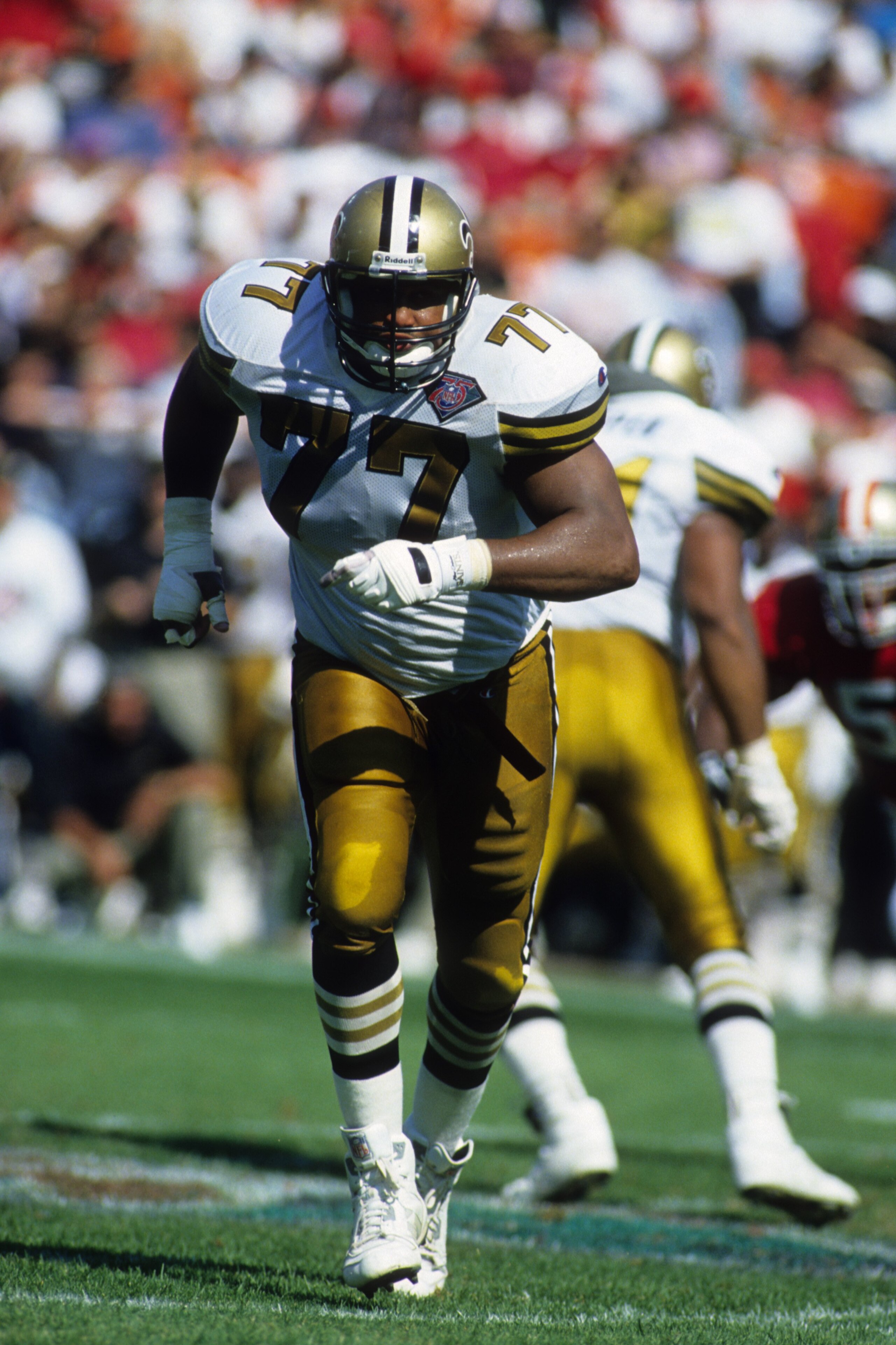 SAN FRANCISCO - SEPTEMBER 25:  Tackle Willie Roaf #77 of the New Orleans Saints on the field during the game against the San Francisco 49ers at Candlestick Park on September 25, 1994 in San Francisco, California.  The 49ers won 24-13.  (Photo by George Ro