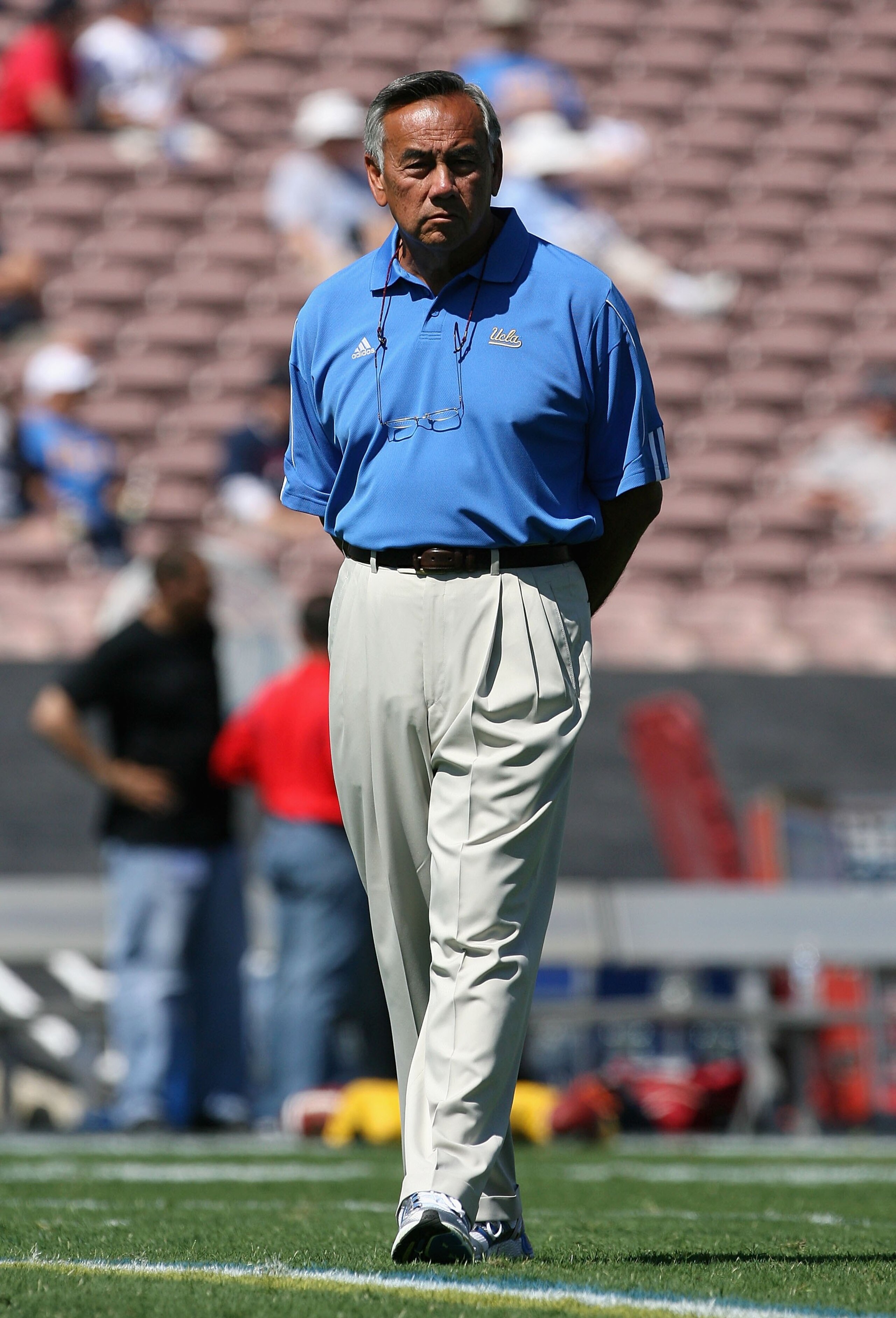PASADENA, CA - SEPTEMBER 20:  Offensive Coordinatorm Norm Chow of the UCLA Bruins watches warm ups before the college football game against the Arizona Wildcats at the Rose Bowl on September 13, 2008 in Pasadena, California. The Wildcats defeated the Brui