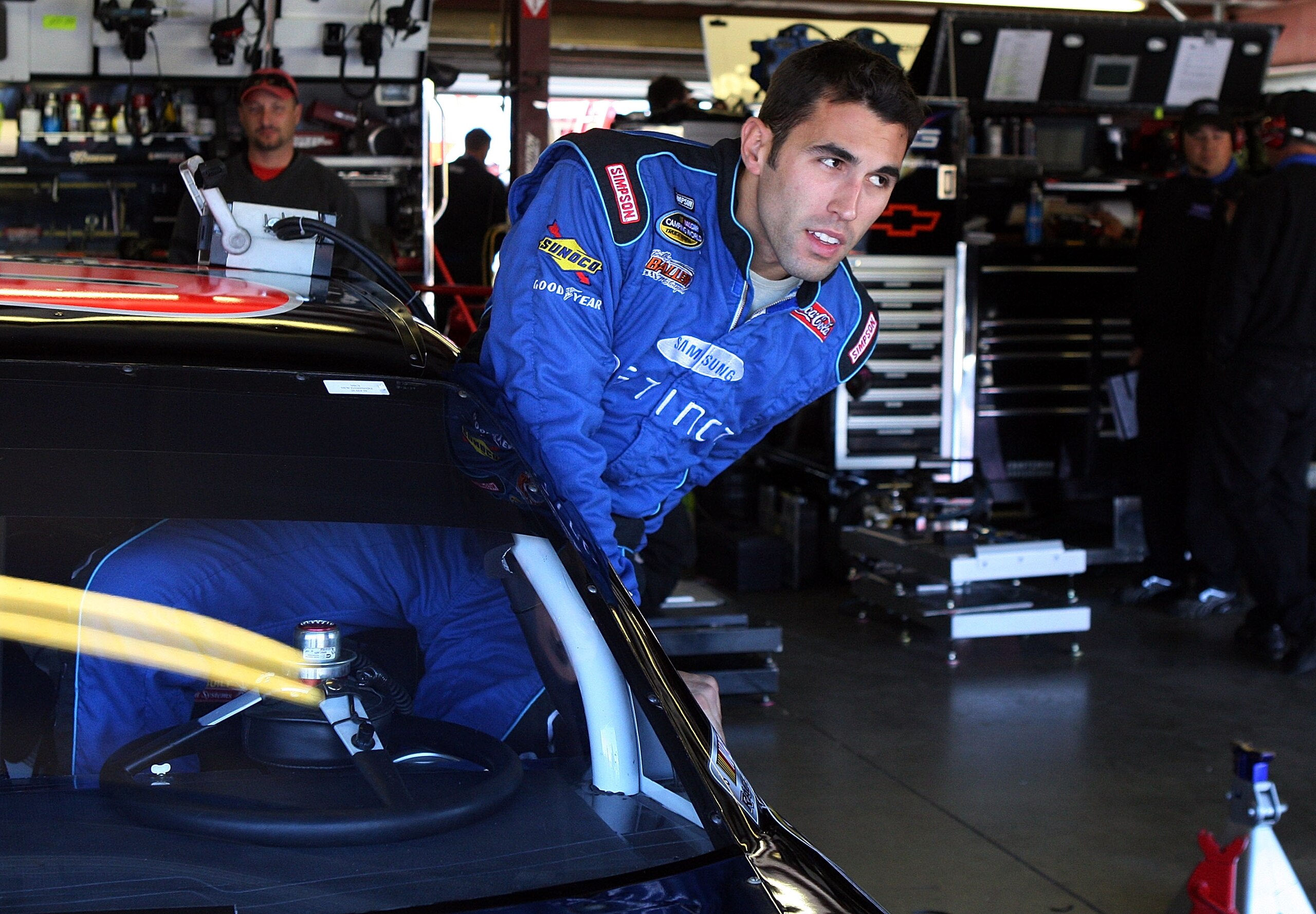 LOUDON, NH - SEPTEMBER 19:  Aric Amirola, driver of the #09 Miccosukee Indian Gaming & Resort Chevrolet, climbs into his car during practice for the NASCAR Sprint Cup Series Sylvania 300 at the New Hampshire Motor Speedway on September 19, 2009 in Loudon,