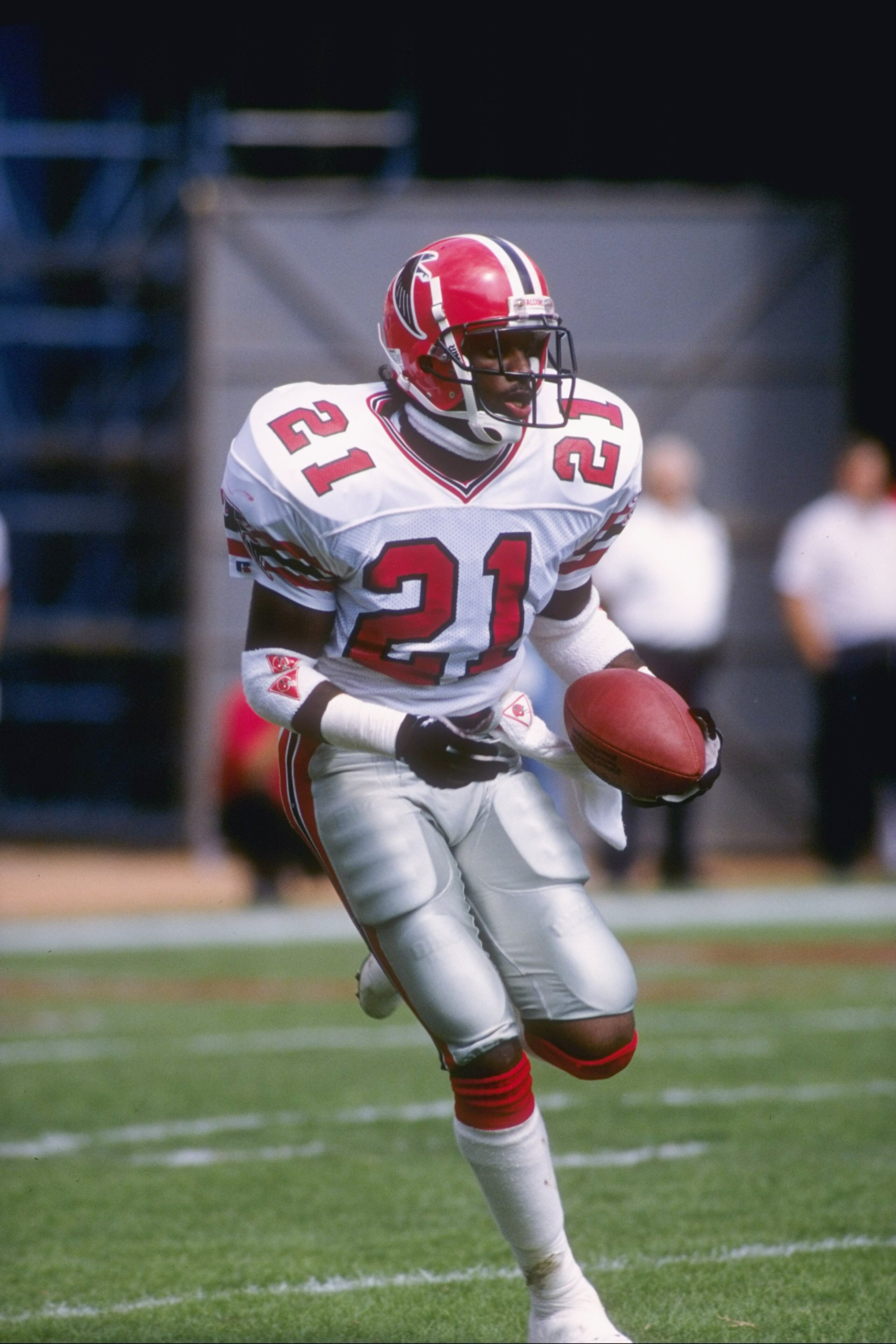 15 Oct 1989:  Defensive back Deion Sanders of the Atlanta Falcons runs with the ball during a game against the New England Patriots at Fulton County Stadium in Atlanta, Georgia.  The Falcons won the game 16-15. Mandatory Credit: Rick Stewart  /Allsport