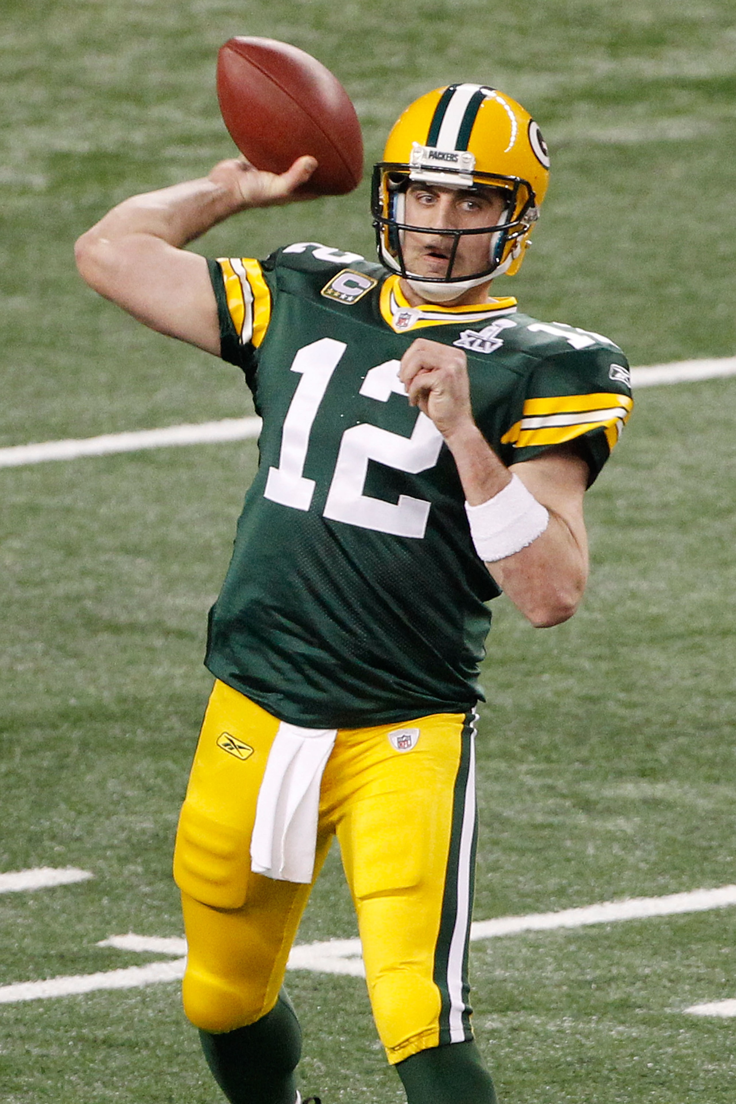 ARLINGTON, TX - FEBRUARY 06:  Aaron Rodgers #12 of the Green Bay Packers drops back against the Pittsburgh Steelers in the second quarter of Super Bowl XLV at Cowboys Stadium on February 6, 2011 in Arlington, Texas.  (Photo by Joe Robbins/Getty Images)