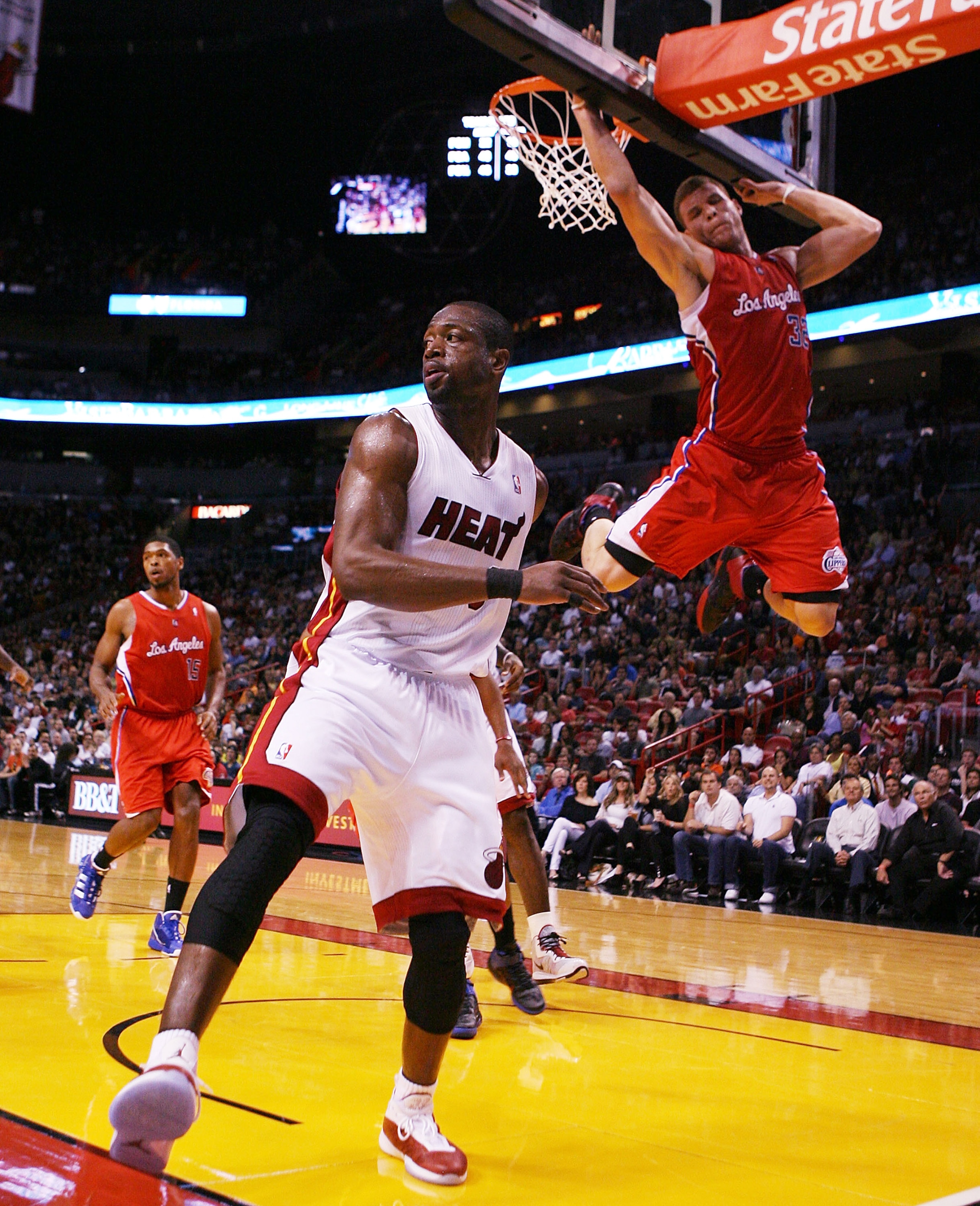 MIAMI - FEBRUARY 06:  Guard Dwyane Wade #3 of the Miami Heat passes against guard Forward Blake Griffin #32 of the L.A. Clippers at American Airlines Arena on February 6, 2011 in Miami, Florida. NOTE TO USER: User expressly acknowledges and agrees that, b