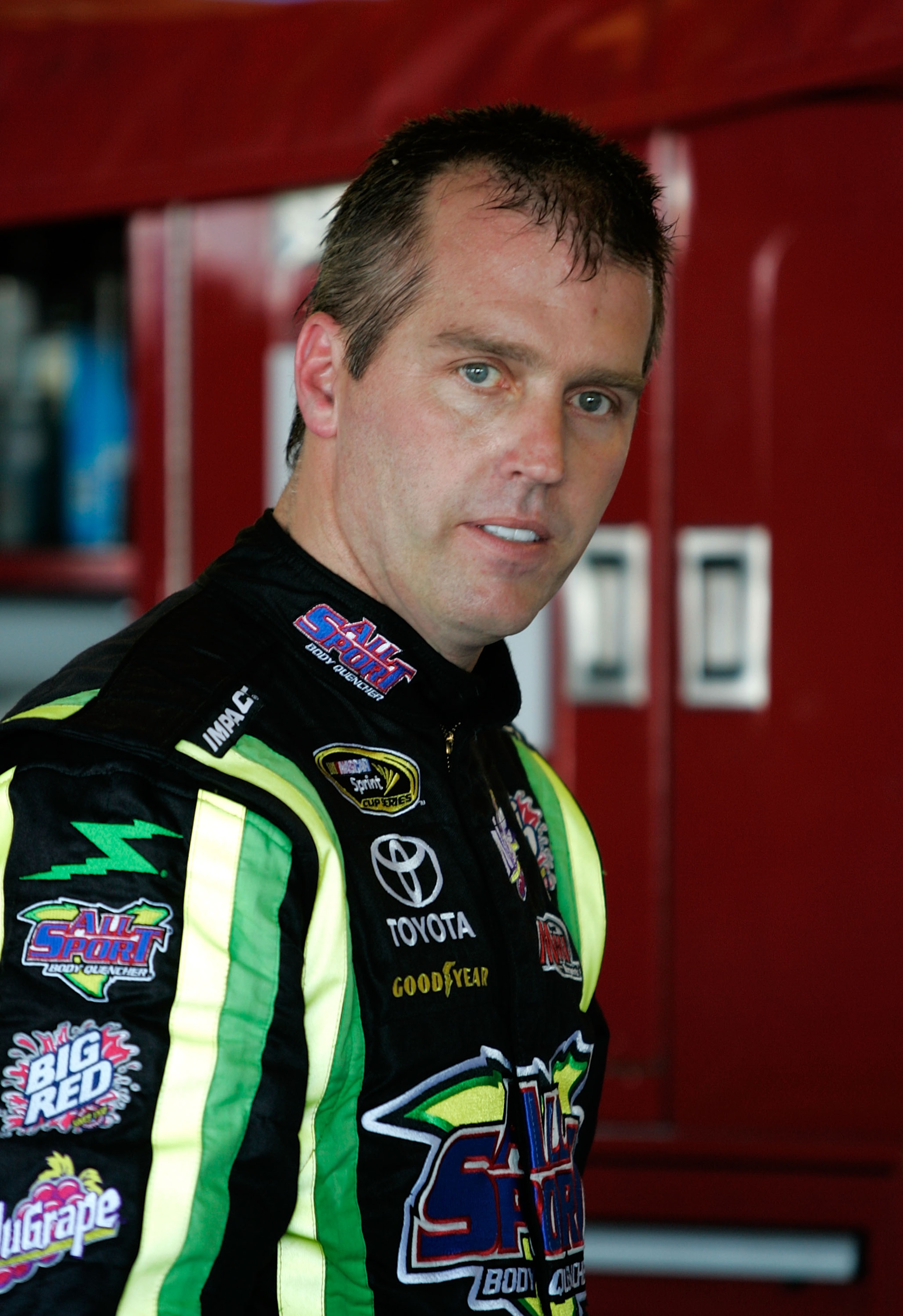 TALLADEGA, AL - APRIL 24:  Jeremy Mayfield, driver of the #41 All Sport Body Quencher Toyota, waits in the garage area during practice for the NASCAR Sprint Cup Series Aaron's 499 at Talladega Superspeedway on April 24, 2009 in Talladega, Alabama.  (Photo