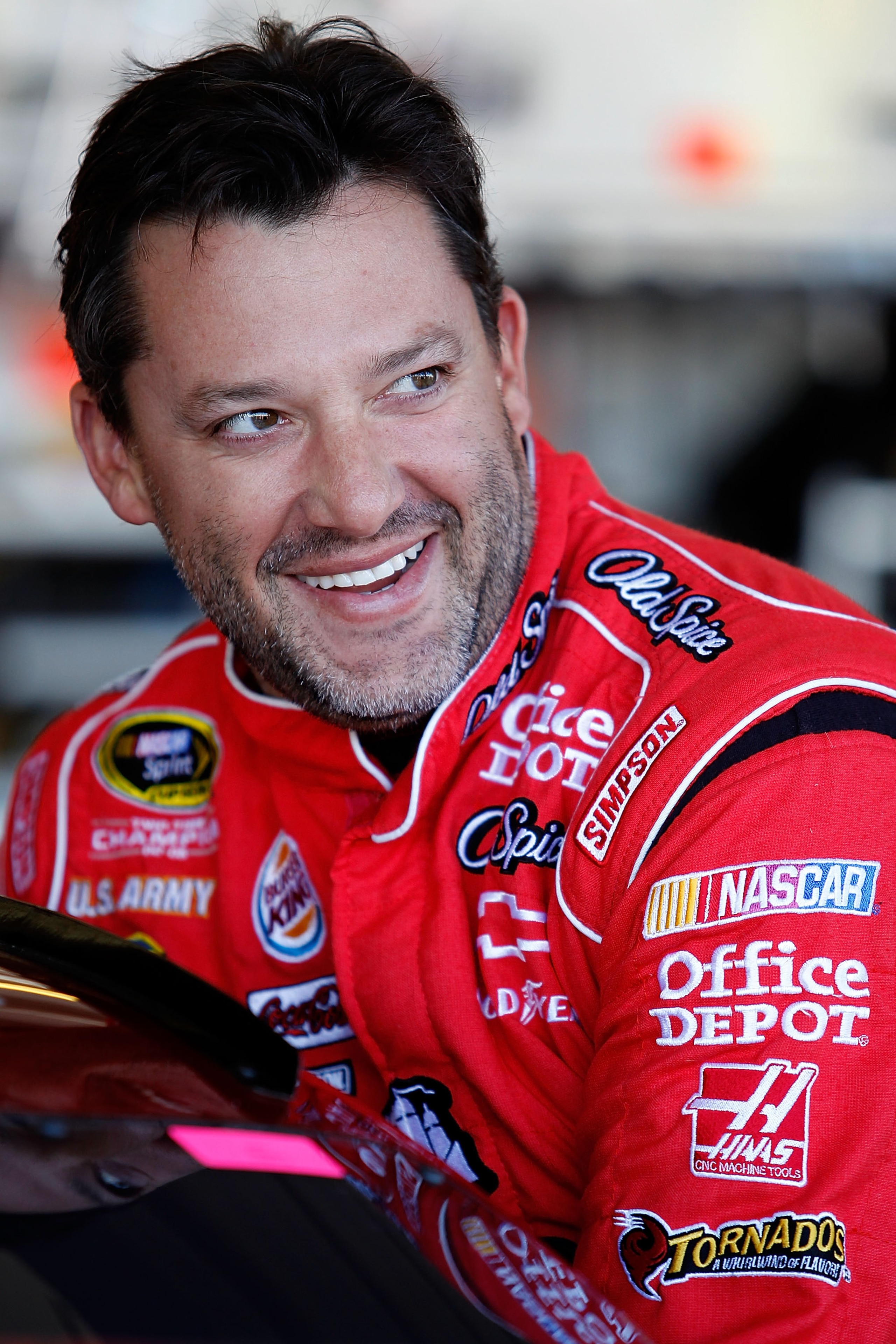 AVONDALE, AZ - NOVEMBER 12:  Tony Stewart, driver of the #14 Old Spice/Office Depot Chevrolet, waits in the garage prior to practice for the NASCAR Sprint Cup Series Kobalt Tools 500 at Phoenix International Raceway on November 12, 2010 in Avondale, Arizo