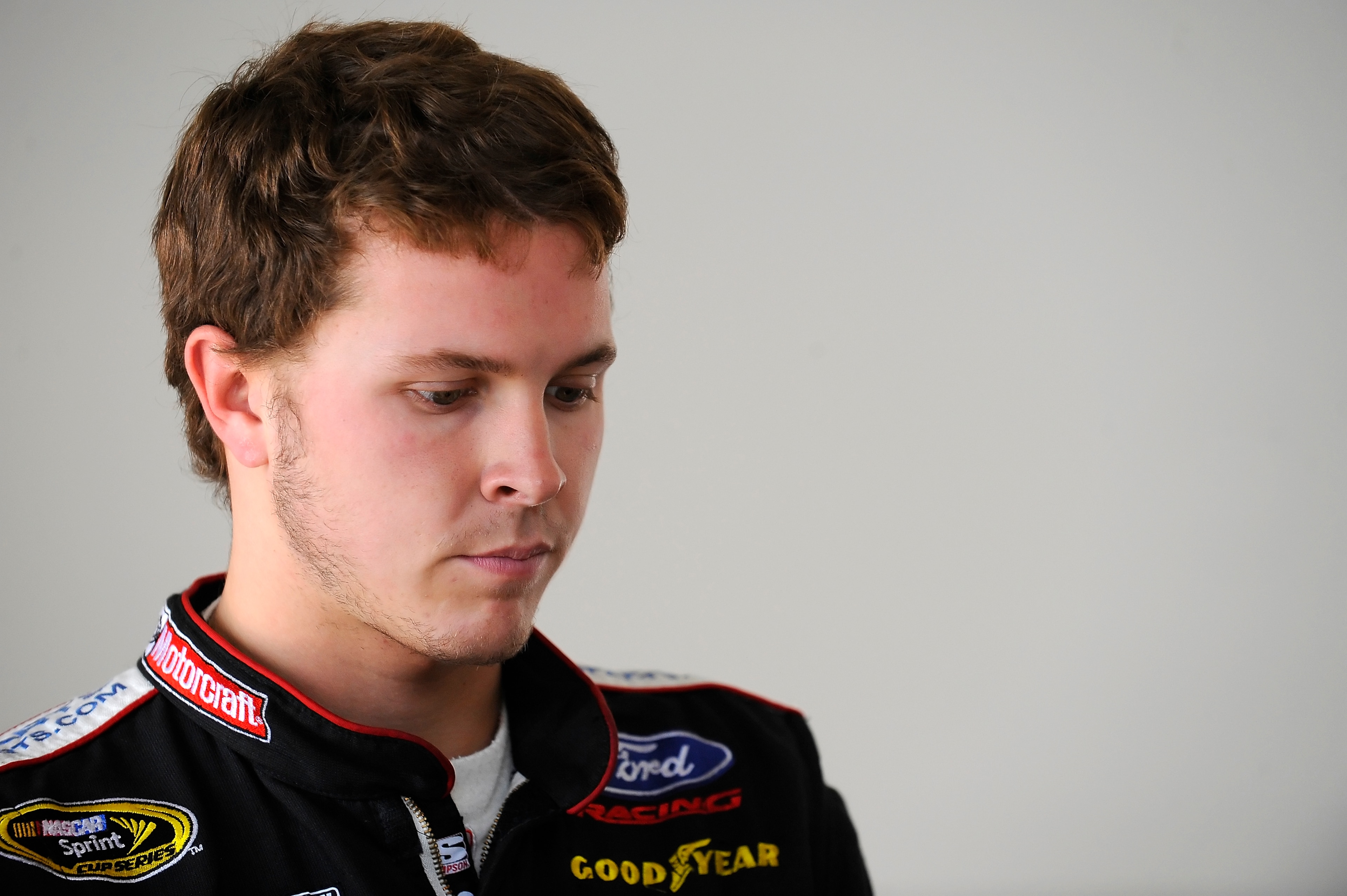 DAYTONA BEACH, FL - JANUARY 22: Trevor Bayne, driver of the #21 Woods Brothers Racing Ford, waits in the garage for testing at Daytona International Speedway on January 22, 2011 in Daytona Beach, Florida. (Photo by Jared C. Tilton/Getty Images for NASCA DAYTONA BEACH, FL - JANUARY 22: Trevor Bayne, driver of the #21 Woods Brothers Racing Ford, waits in the garage for testing at Daytona International Speedway on January 22, 2011 in Daytona Beach, Florida. (Photo by Jared C. Tilton/Getty Images for NASCA