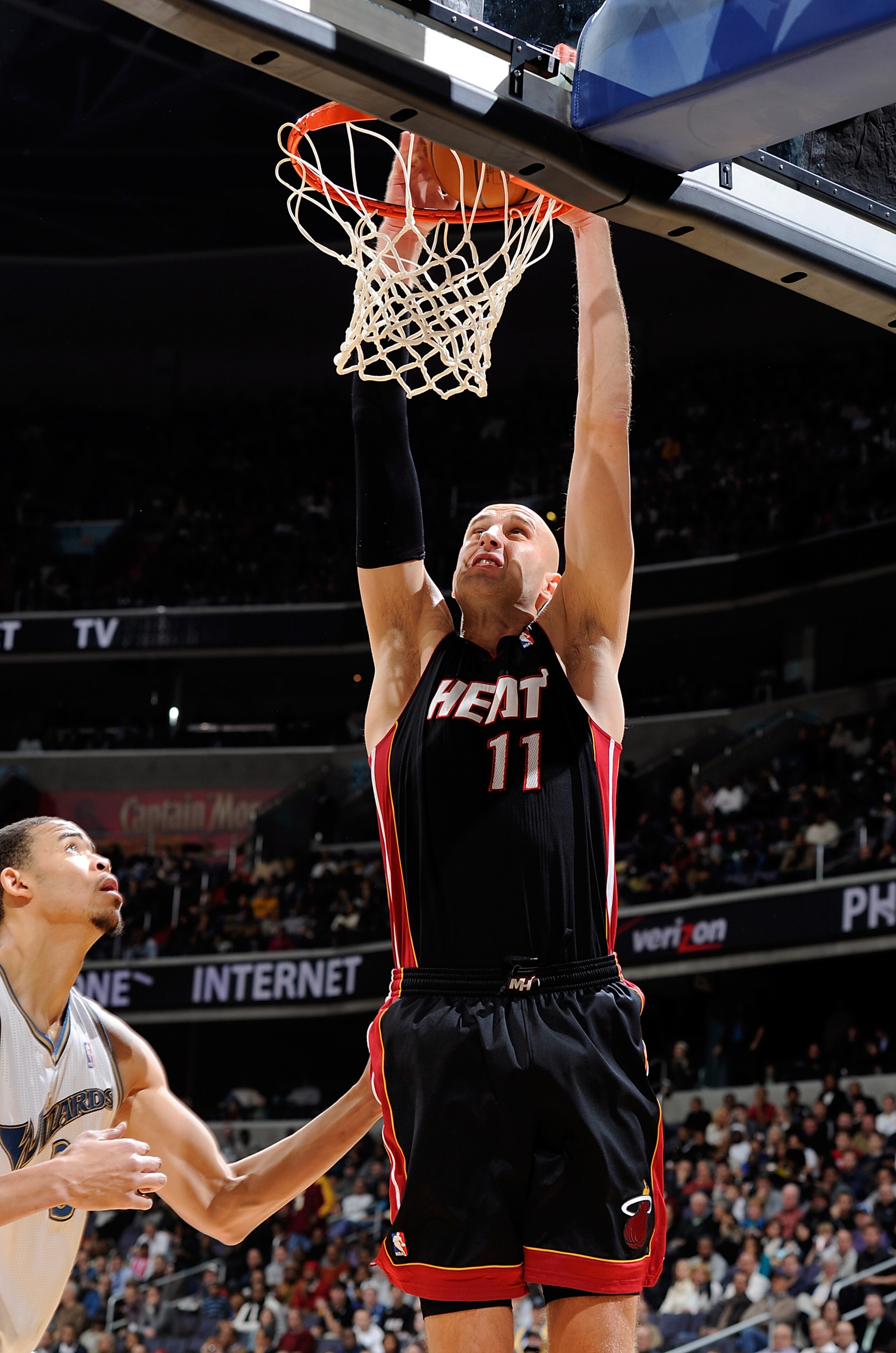 WASHINGTON, DC - DECEMBER 18:  Zydrunas Ilgauskas #11 of the Miami Heat dunks the ball against the Washington Wizards at the Verizon Center on December 18, 2010 in Washington, DC. NOTE TO USER: User expressly acknowledges and agrees that, by downloading a