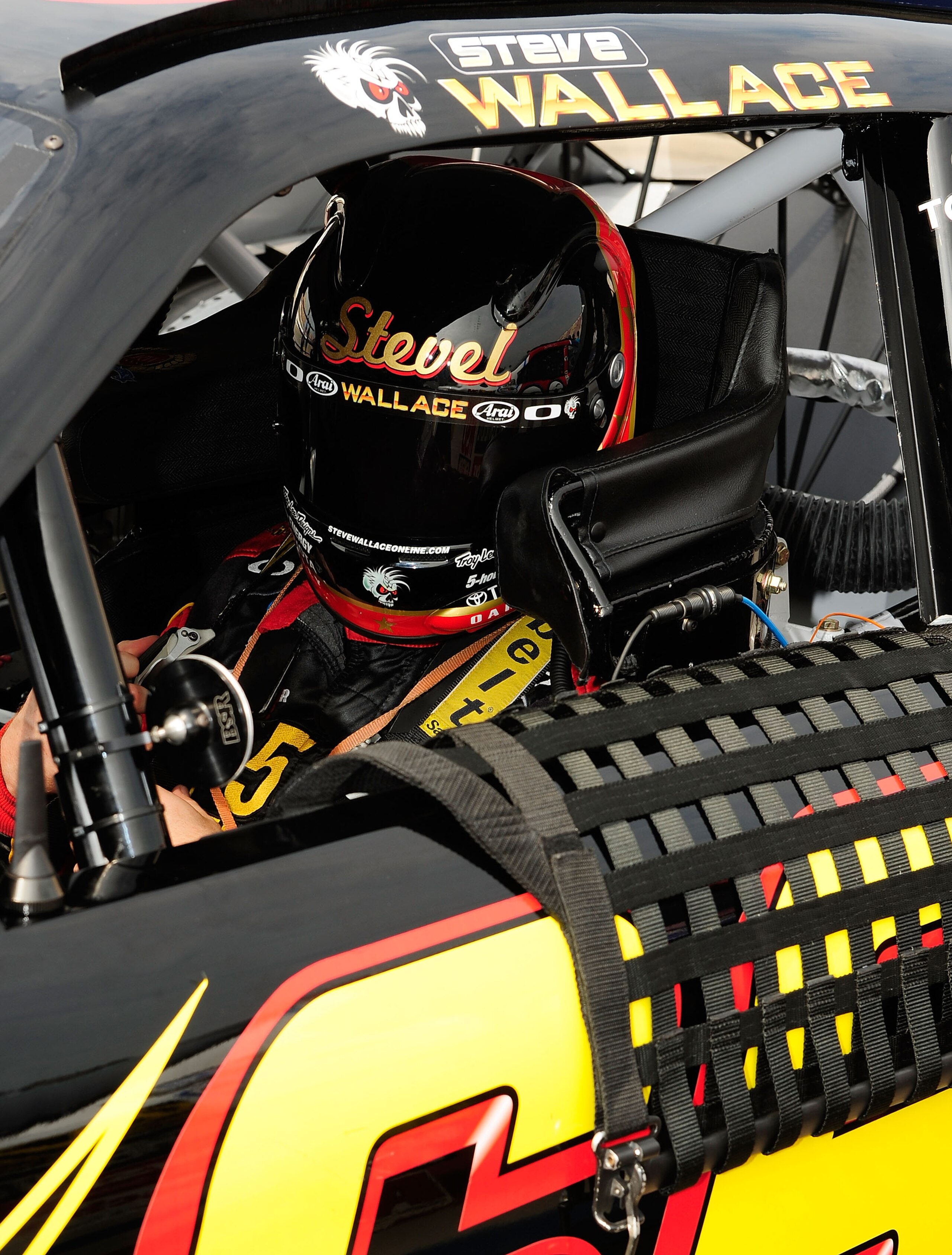 BROOKLYN, MI - AUGUST 14:  Steve Wallace, driver of the 5-hour Energy Toyota, sits in his car during qualifying for the NASCAR Nationwide Series CARFAX 250 at Michigan International Speedway on August 14, 2010 in Brooklyn, Michigan.  (Photo by Rusty Jarre