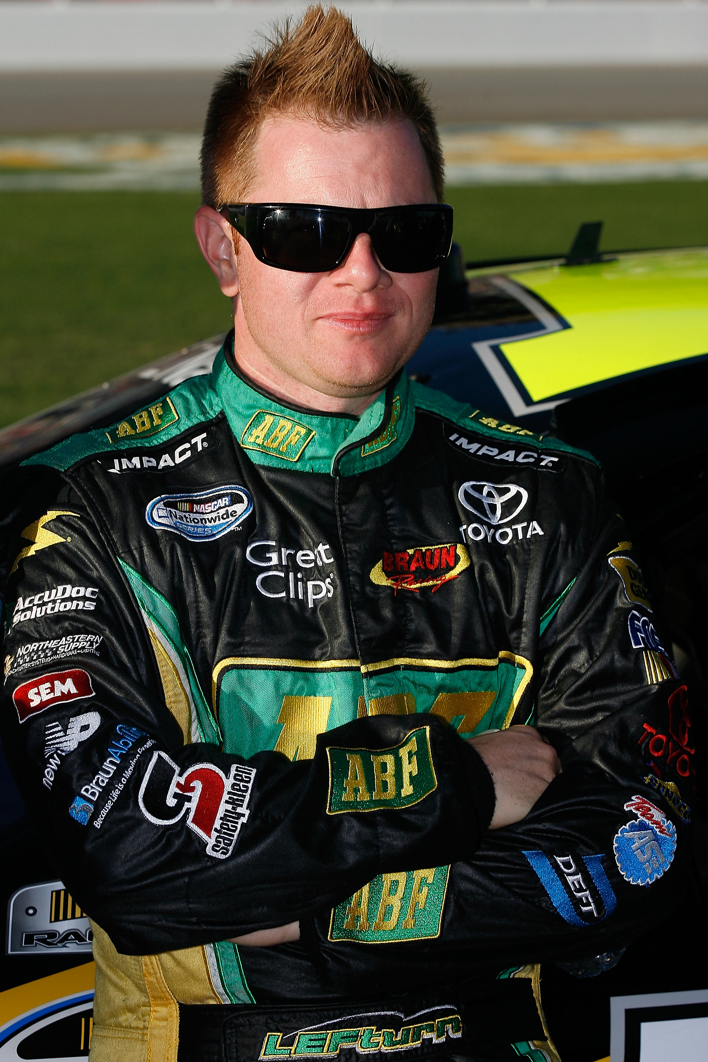 HAMPTON, GA - SEPTEMBER 04:  Jason Leffler, driver of the #10 ABF Toyota, stands on the grid prior to the start of the NASCAR Nationwide Series Great Clips 300 at Atlanta Motor Speedway on September 4, 2010 in Hampton, Georgia.  (Photo by Tom Whitmore/Get