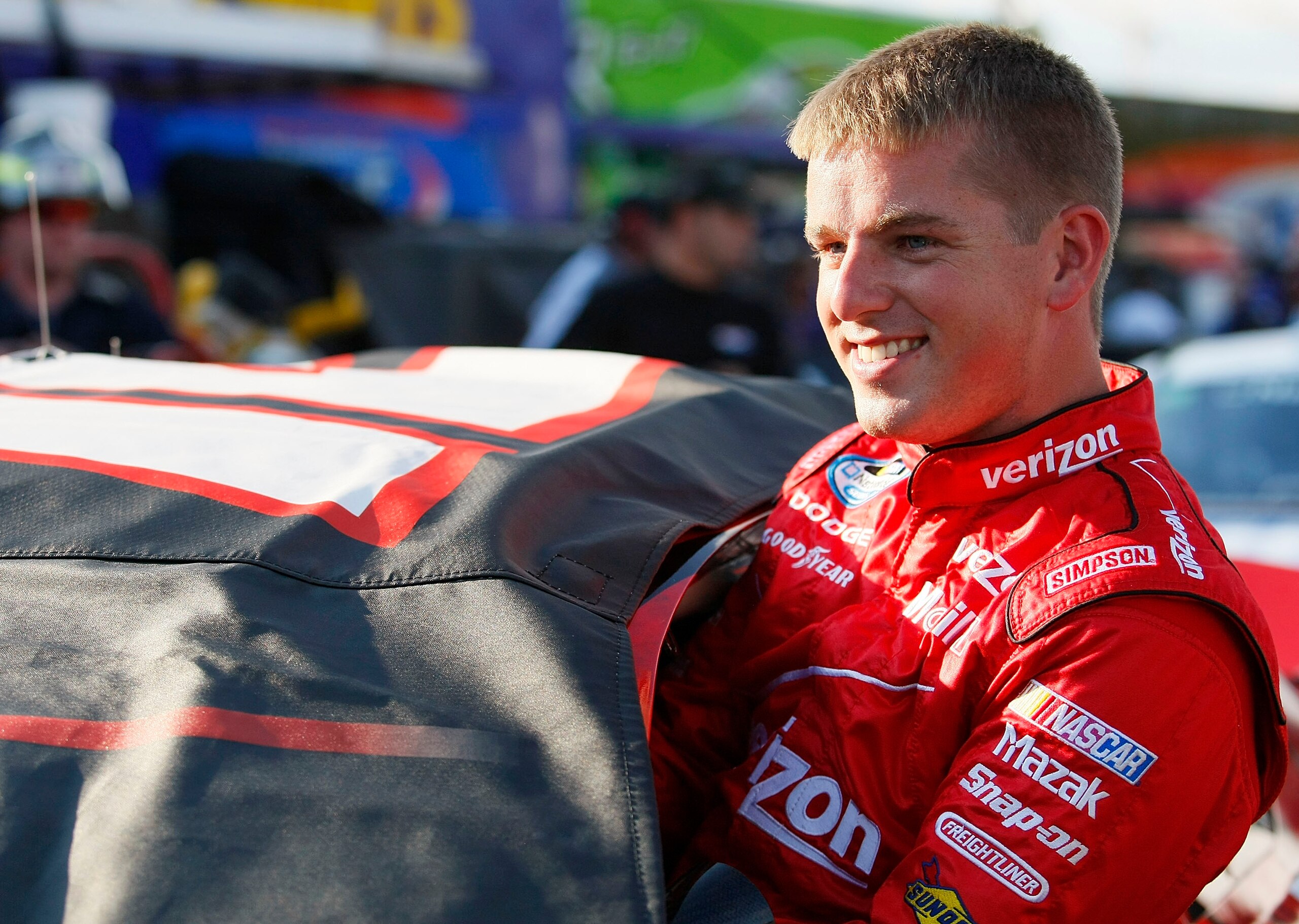 MONTREAL - AUGUST 28: Justin Allgaier, driver of the #12 Verizon Wireless Dodge, climbs into his car in the garage area during qualifying for the NASCAR Nationwide Series NAPA Auto Parts 200 at Circuit Gilles-Villeneuve on August 28, 2010 in Montreal, Can