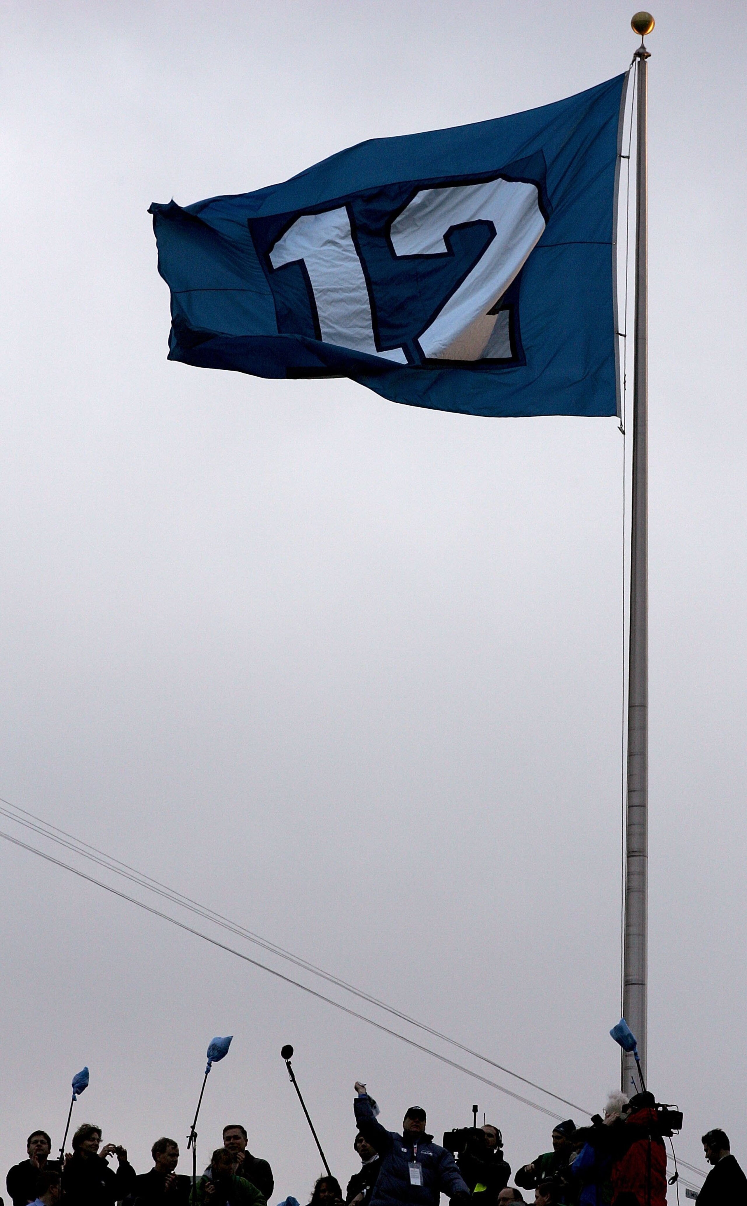 SEATTLE - JANUARY 22: A flag representing the '12th man' in honor of Seattle Seahawks fans flies at the NFC Championship Game between the Seattle Seahawks and the Carolina Panthers at Qwest Stadium on January 22, 2006 in Seattle, Washington. (Photo by H SEATTLE - JANUARY 22: A flag representing the '12th man' in honor of Seattle Seahawks fans flies at the NFC Championship Game between the Seattle Seahawks and the Carolina Panthers at Qwest Stadium on January 22, 2006 in Seattle, Washington. (Photo by H