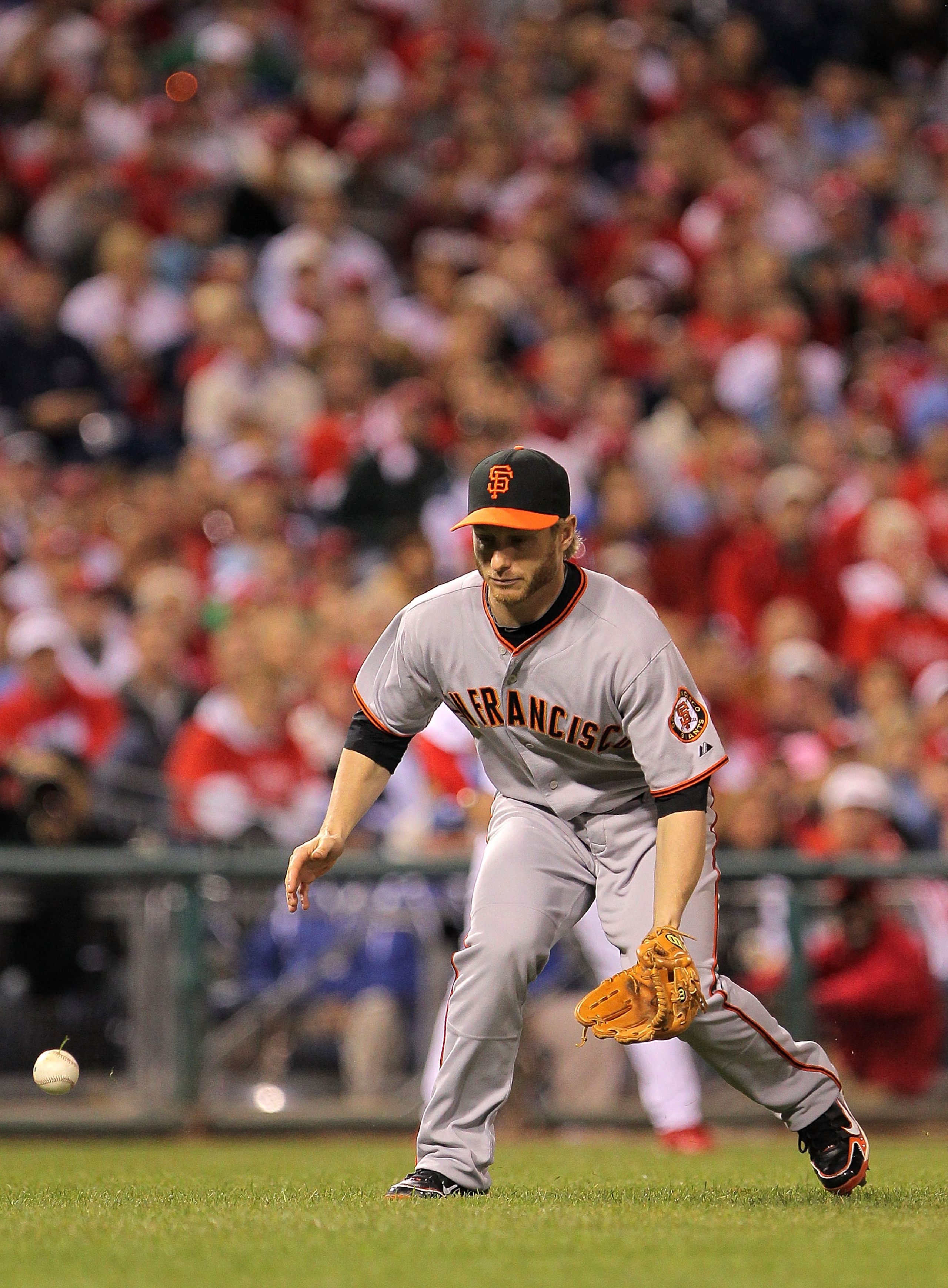 PHILADELPHIA - OCTOBER 17:  Mike Fontenot #14 of the San Francisco Giants watches as an infield pop-up hit by Jimmy Rollins #11 of the Philadelphia Phillies falls in front of him in the fourth inning of Game Two of the NLCS during the 2010 MLB Playoffs at