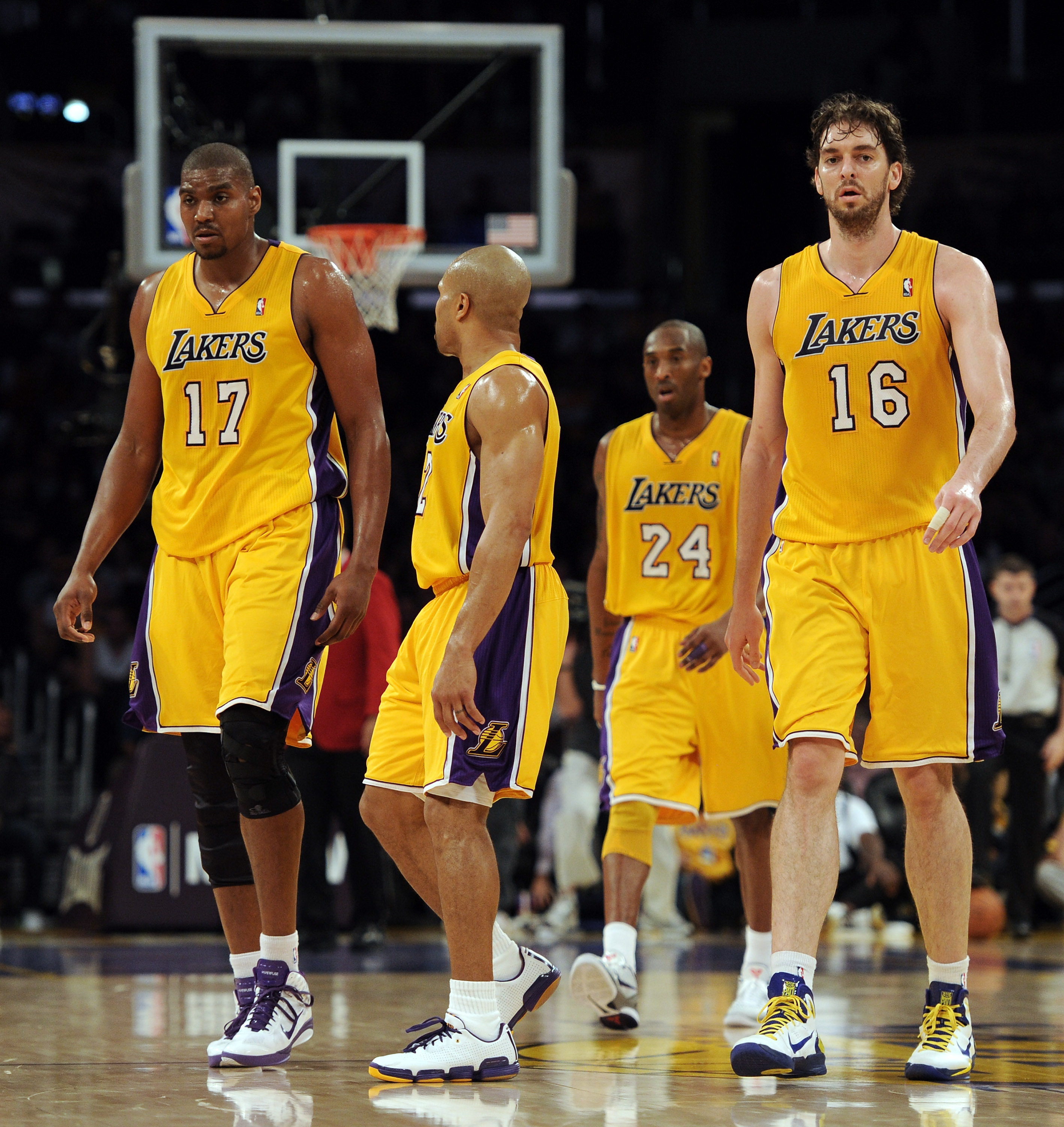 LOS ANGELES, CA - FEBRUARY 03:  Pau Gasol #16, Andrew Bynum #17, Kobe Bryant #24 and Derek Fisher #2 of the Los Angeles Lakers head to the bench after a time out trailing the San Antonio Spurs during the second half at Staples Center on February 3, 2011 i
