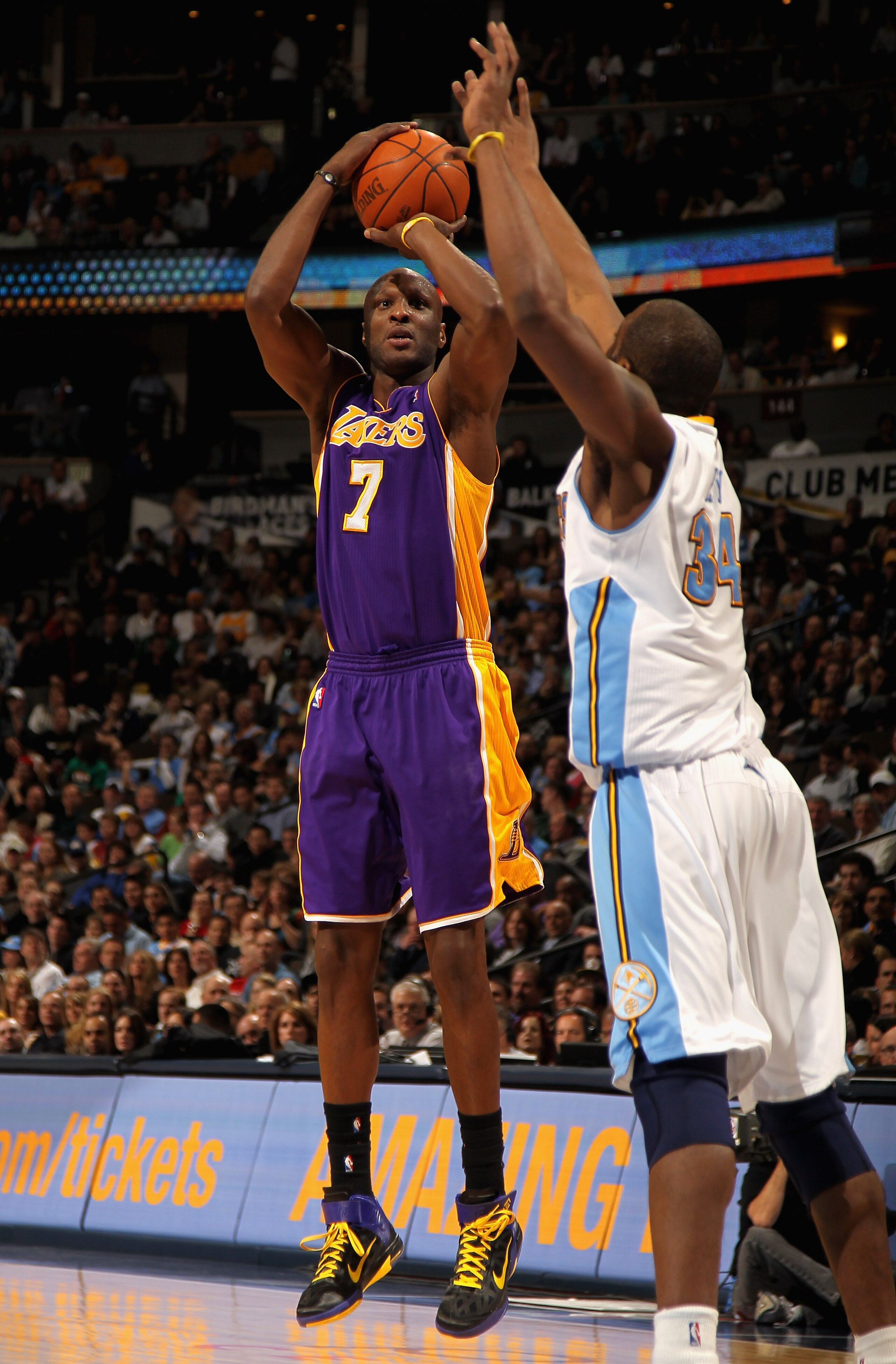 DENVER, CO - JANUARY 21:  Lamar Odom #7 of the Los Angeles Lakers takes a shot against Melvin Ely #34 of the Denver Nuggets at the Pepsi Center on January 21, 2011 in Denver, Colorado. NOTE TO USER: User expressly acknowledges and agrees that, by download