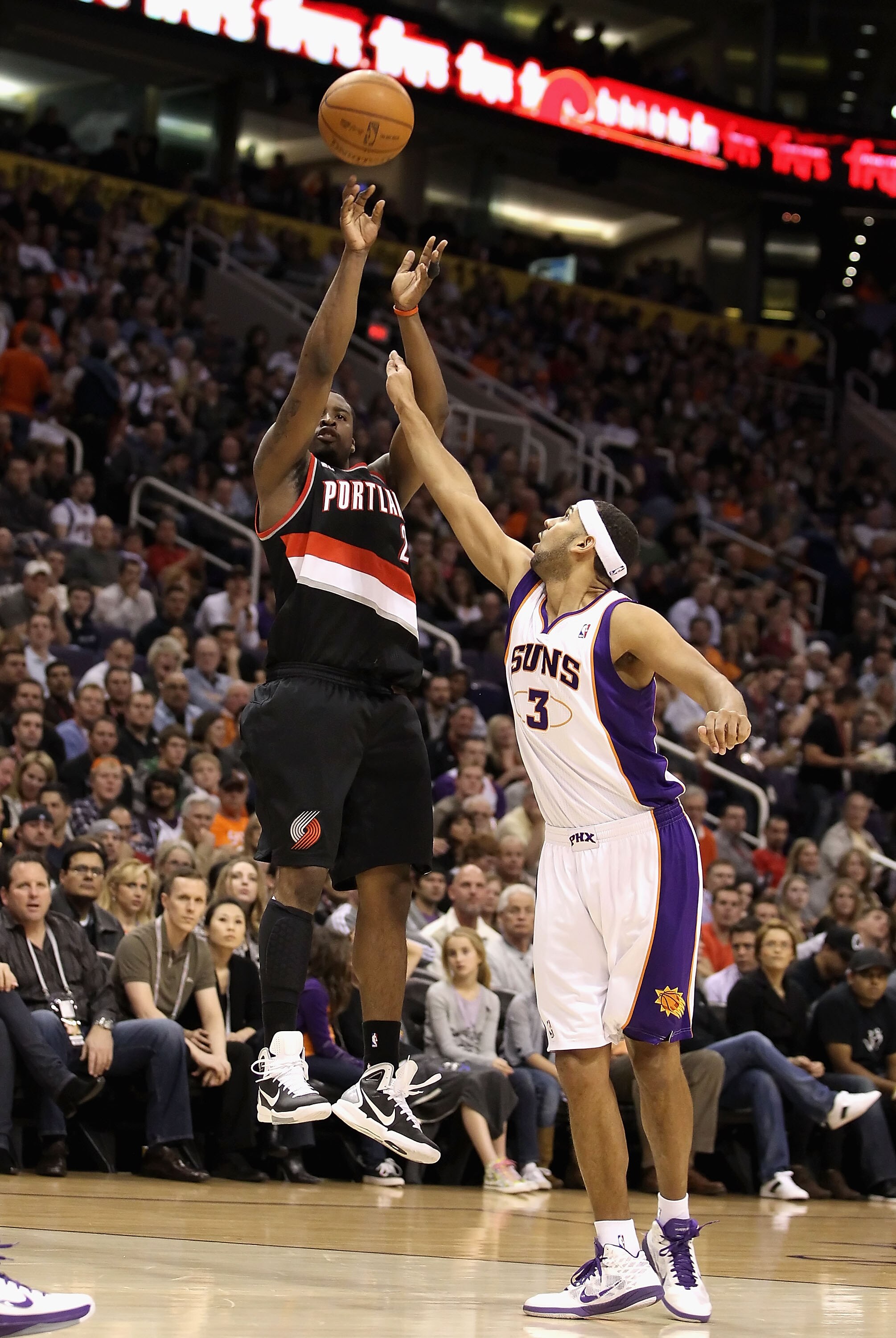 PHOENIX, AZ - JANUARY 14:  Wesley Matthews #2 of the Portland Trail Blazers puts up a shot over Jared Dudley #3 of the Phoenix Suns during the NBA game at US Airways Center on January 14, 2011 in Phoenix, Arizona.  NOTE TO USER: User expressly acknowledge