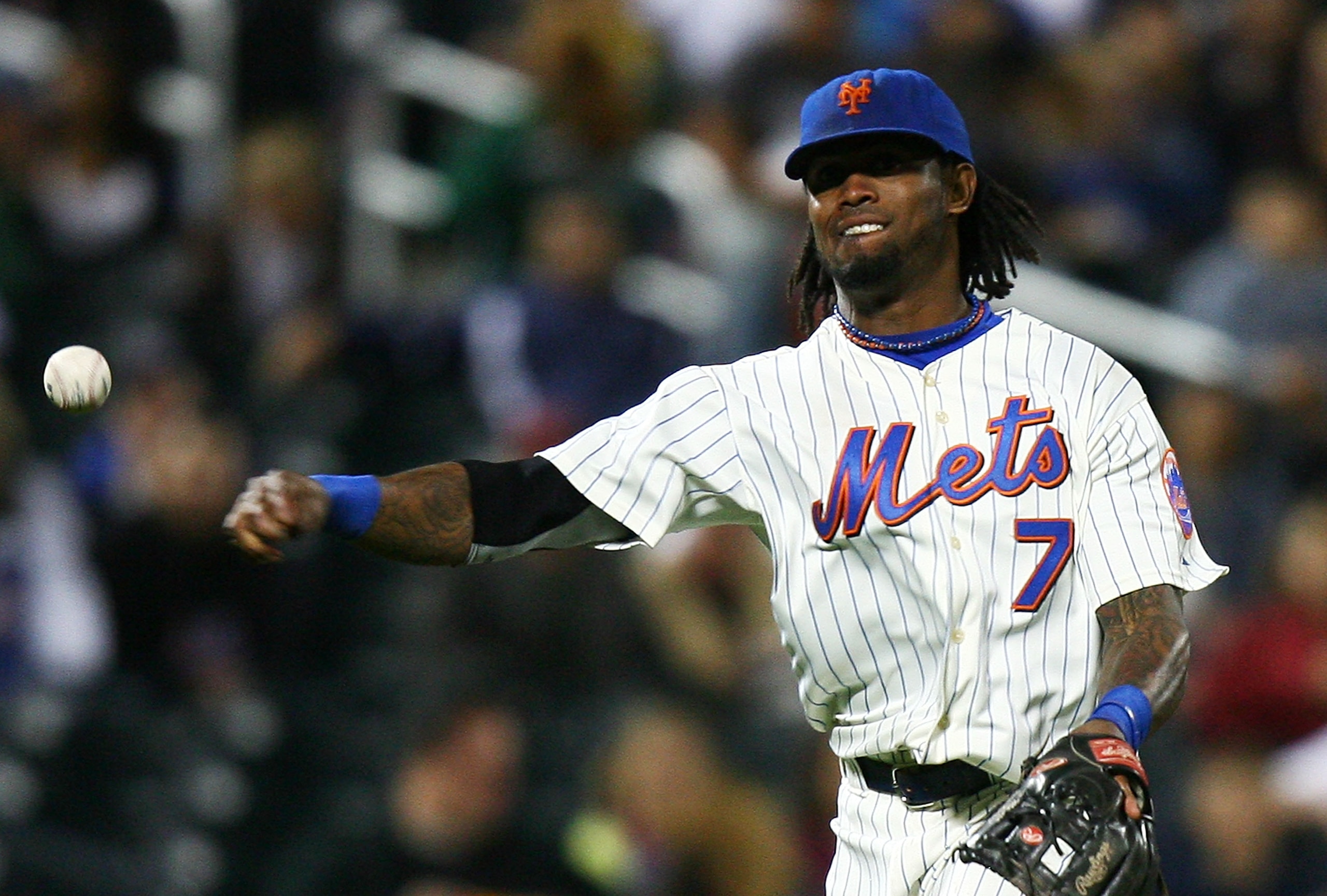 NEW YORK - SEPTEMBER 15:  Jose Reyes #7 of the New York Mets fields a ball against the Pittsburgh Pirates on September 15, 2010 at Citi Field in the Flushing neighborhood of the Queens borough of New York City.  (Photo by Andrew Burton/Getty Images)