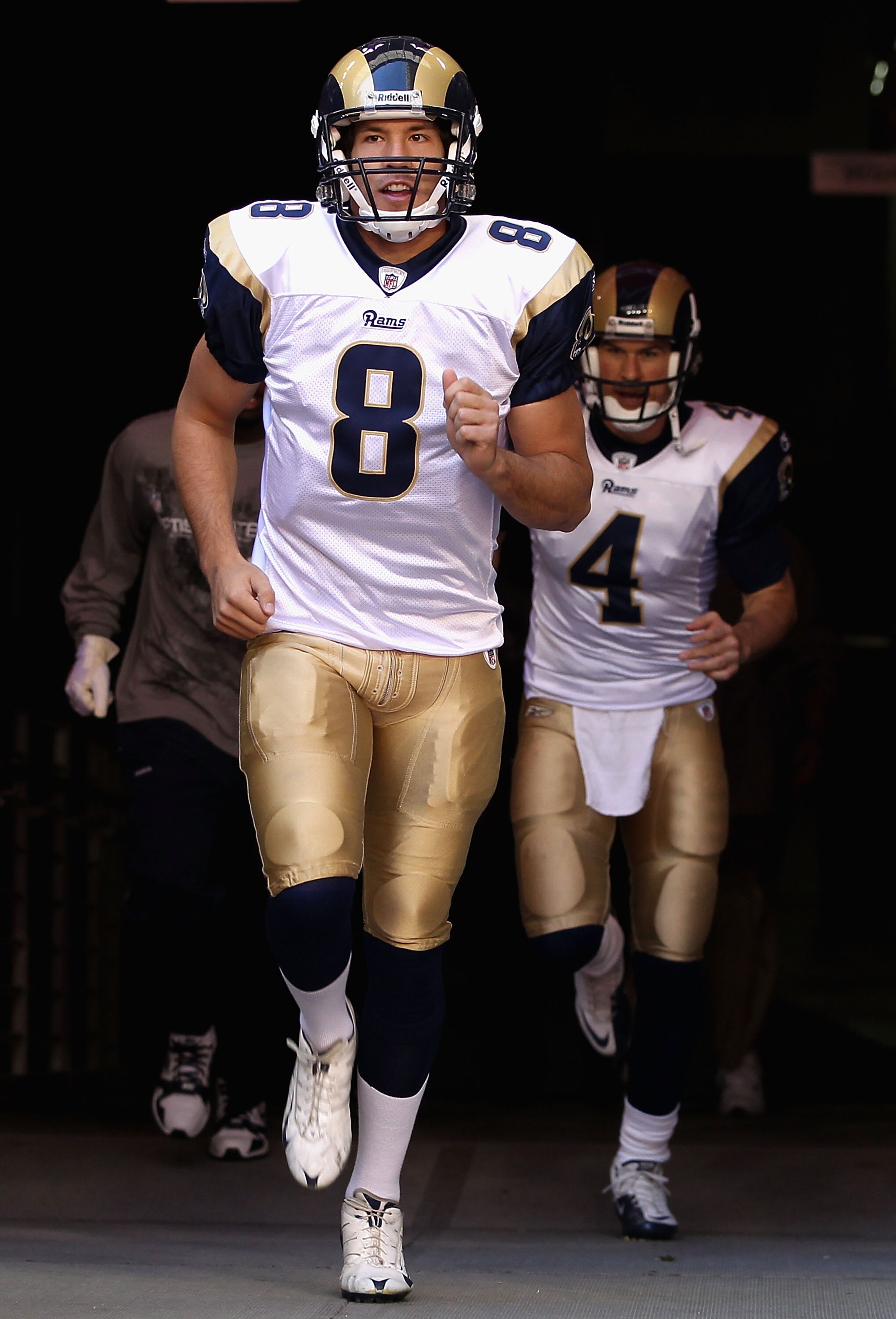 GLENDALE, AZ - DECEMBER 05:  Quarterback Sam Bradford #8 of the St. Louis Rams runs out onto the field before the NFL game against the Arizona Cardinals at the University of Phoenix Stadium on December 5, 2010 in Glendale, Arizona. The Rams defeated the C