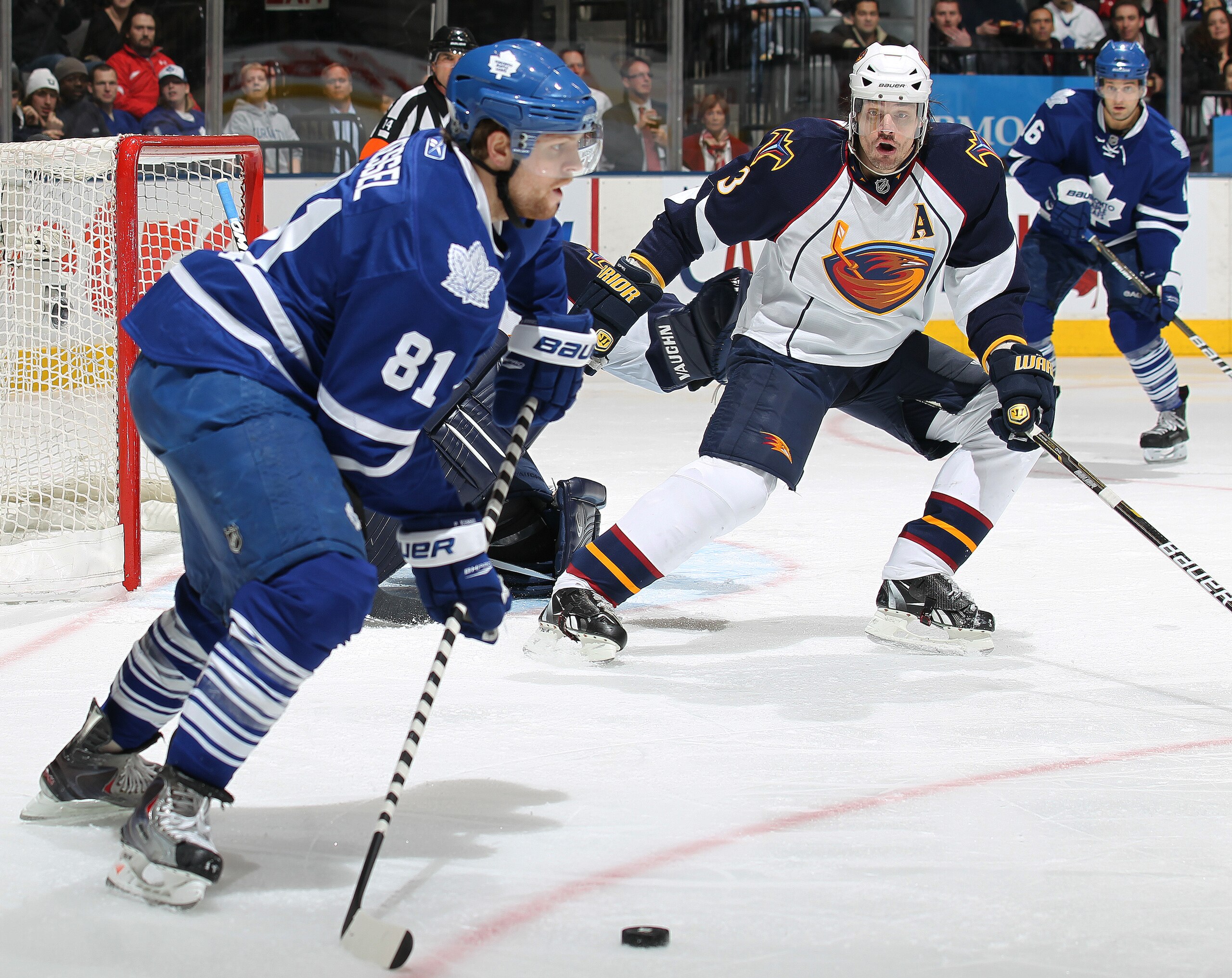 TORONTO, CANADA - FEBRUARY 7:  Brent Sopel #3 of the Atlanta Thrashers keeps an eye on Phil Kessel #81 of the Toronto Maple Leafs in a game on February 7, 2011 at the Air Canada Centre in Toronto, Canada. The Leafs defeated the Thrashers 5-4. (Photo by Cl