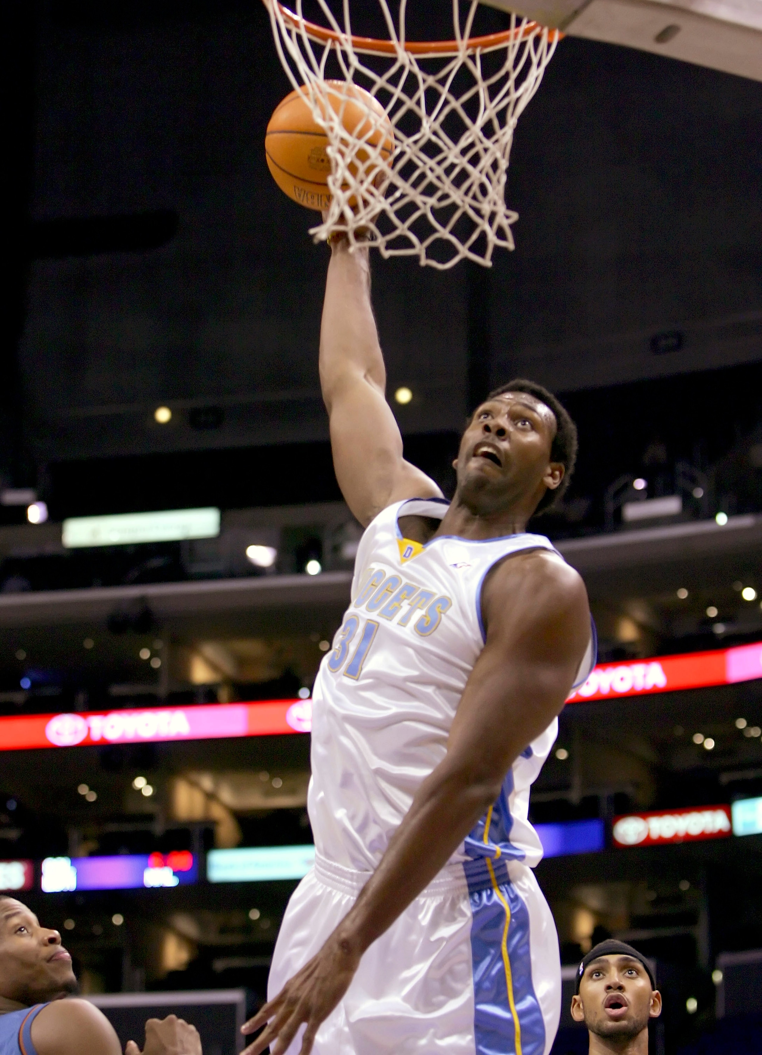 LOS ANGELES - OCTOBER 21: Nene Hilario #31 of the Denver Nuggets slam dunks against the Washington Wizards on October 21, 2005 at Staples Center in Los Angeles, California. NOTE TO USER: User expressly acknowledges and agrees that, by downloading and or LOS ANGELES - OCTOBER 21: Nene Hilario #31 of the Denver Nuggets slam dunks against the Washington Wizards on October 21, 2005 at Staples Center in Los Angeles, California. NOTE TO USER: User expressly acknowledges and agrees that, by downloading and or