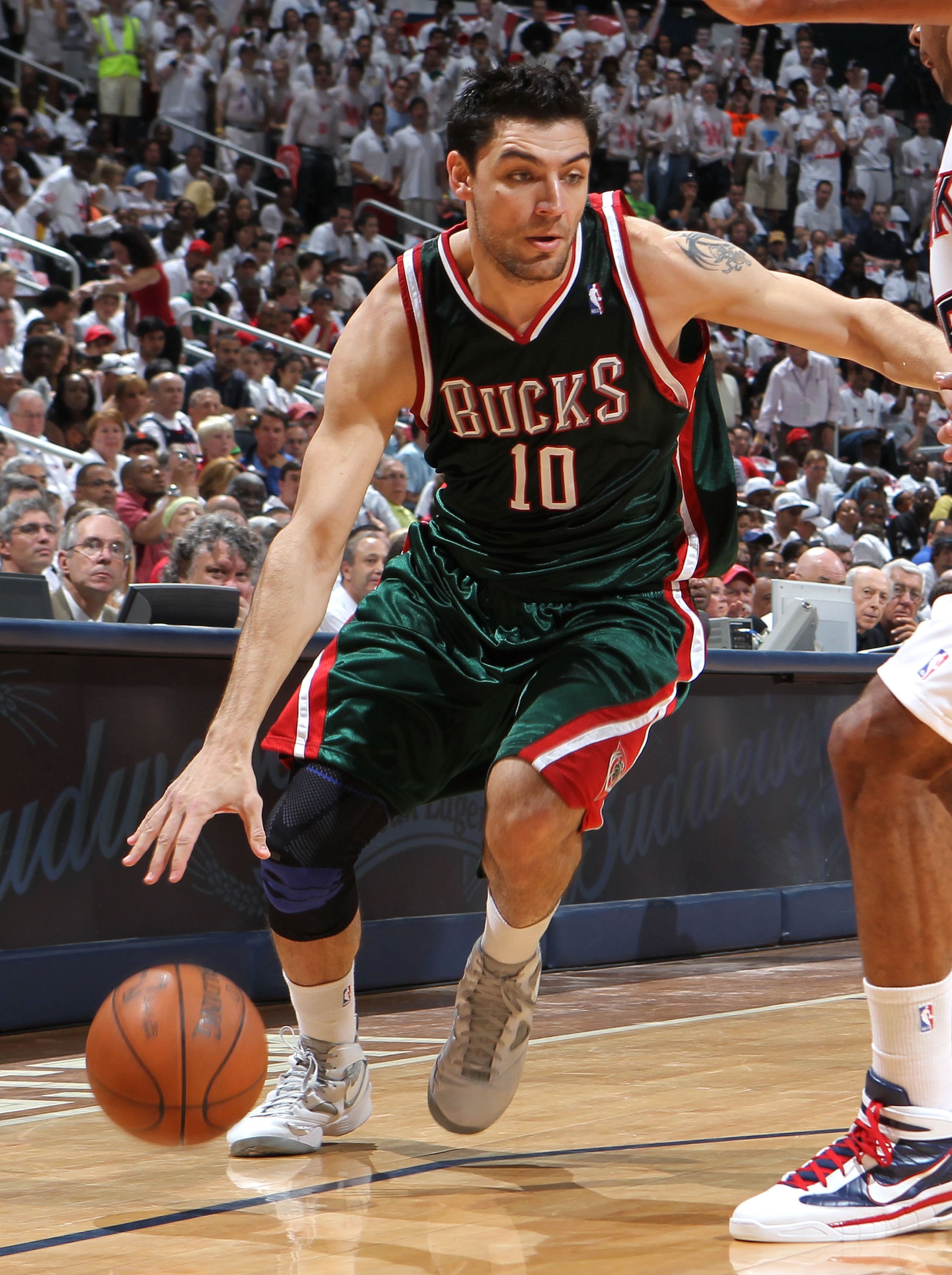 ATLANTA - MAY 2: Forward Carlos Delfino #10 of the Milwaukee Bucks dribbles with the ball during Game Seven of the Eastern Conference Quarterfinals between the Milwaukee Bucks and the Atlanta Hawks during the 2010 NBA Playoffs at Philips Arena on May 2, ATLANTA - MAY 2: Forward Carlos Delfino #10 of the Milwaukee Bucks dribbles with the ball during Game Seven of the Eastern Conference Quarterfinals between the Milwaukee Bucks and the Atlanta Hawks during the 2010 NBA Playoffs at Philips Arena on May 2,