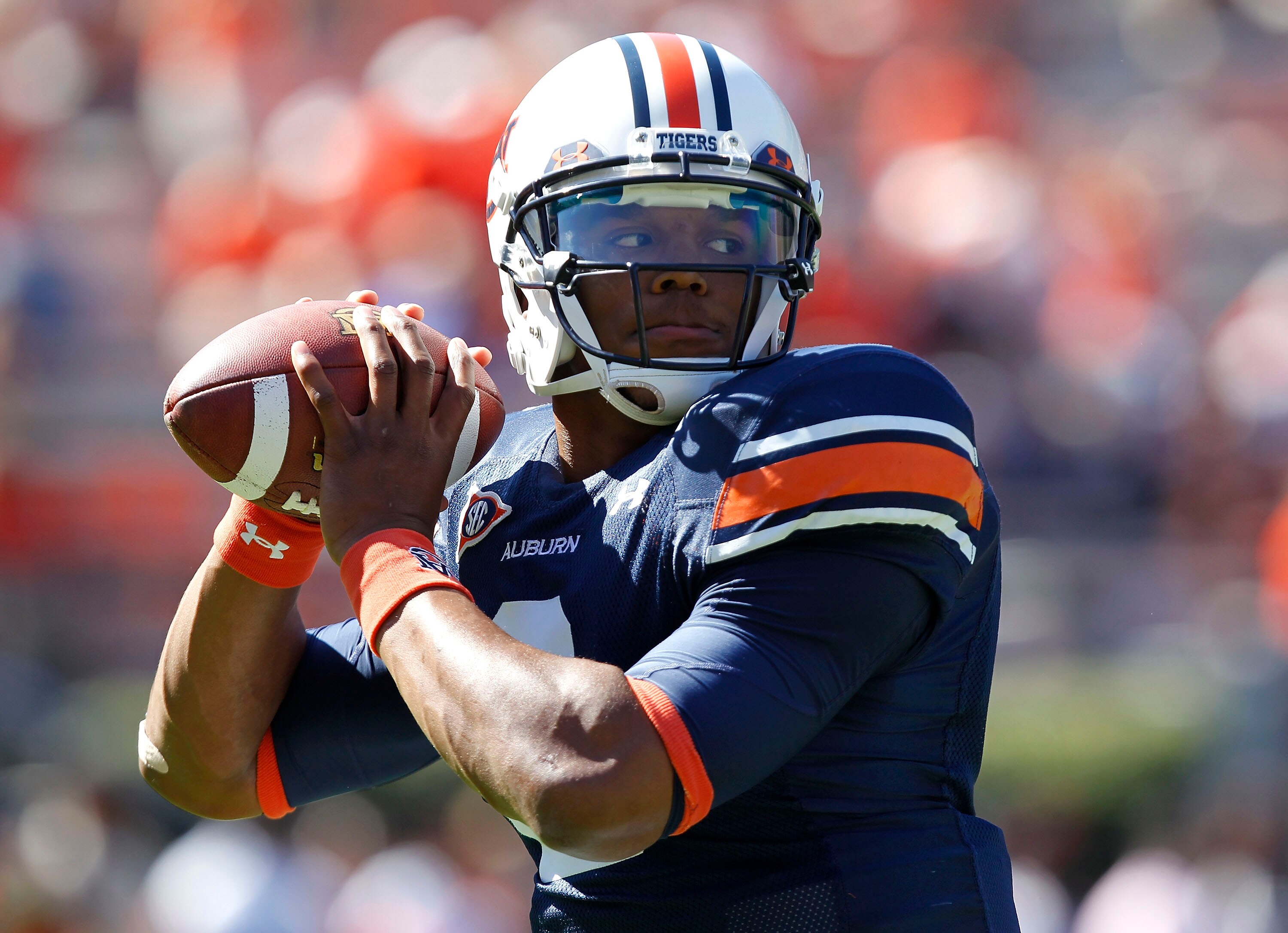 AUBURN, AL - OCTOBER 16:  Quarterback Cam Newton #2 of the Auburn Tigers drops back to throw a practice pass before the game against the Arkansas Razorbacks at Jordan-Hare Stadium on October 16, 2010 in Auburn, Alabama.  (Photo by Mike Zarrilli/Getty Imag