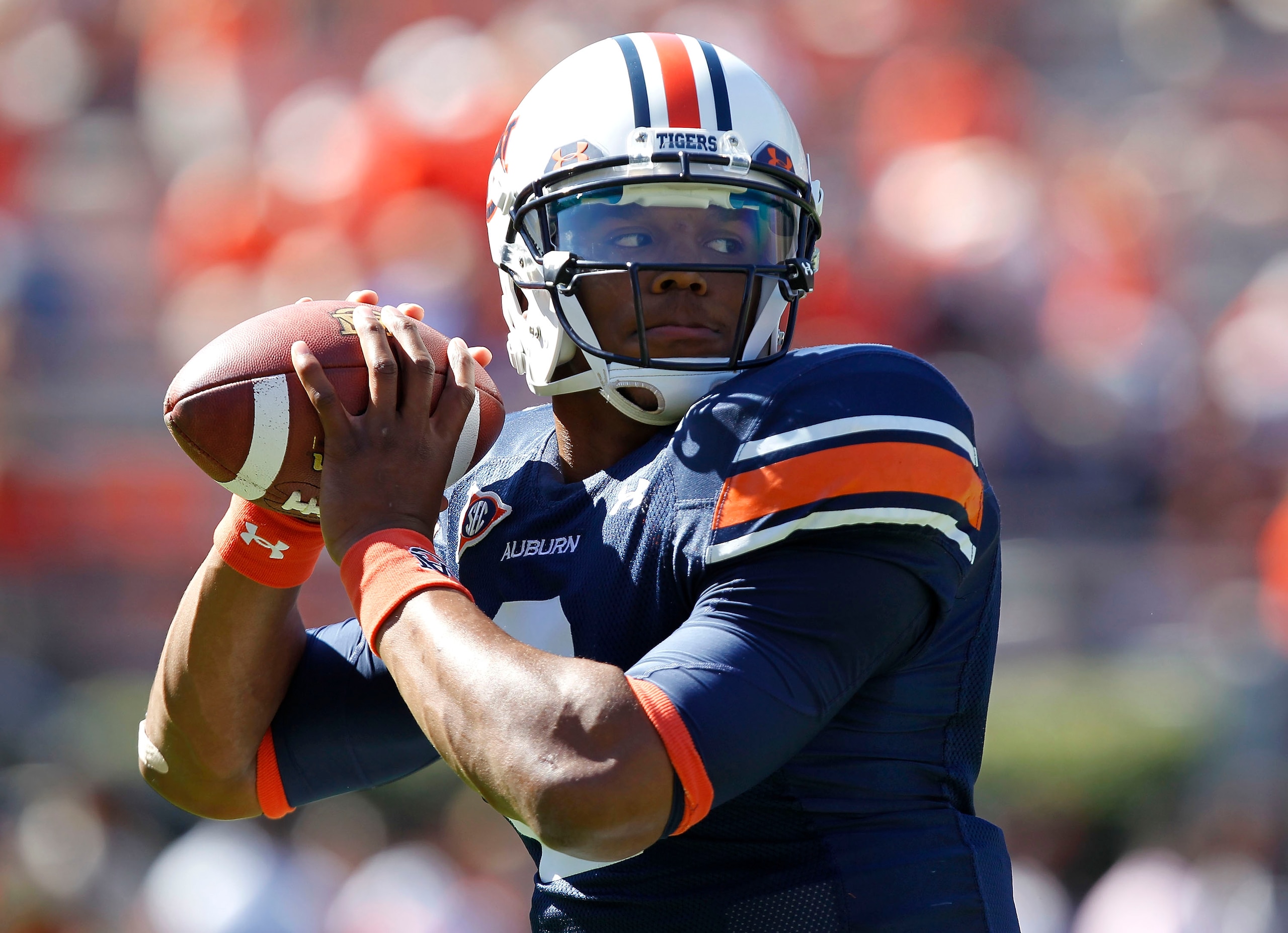 AUBURN, AL - OCTOBER 16: Quarterback Cam Newton #2 of the Auburn Tigers drops back to throw a practice pass before the game against the Arkansas Razorbacks at Jordan-Hare Stadium on October 16, 2010 in Auburn, Alabama. (Photo by Mike Zarrilli/Getty Imag AUBURN, AL - OCTOBER 16: Quarterback Cam Newton #2 of the Auburn Tigers drops back to throw a practice pass before the game against the Arkansas Razorbacks at Jordan-Hare Stadium on October 16, 2010 in Auburn, Alabama. (Photo by Mike Zarrilli/Getty Imag