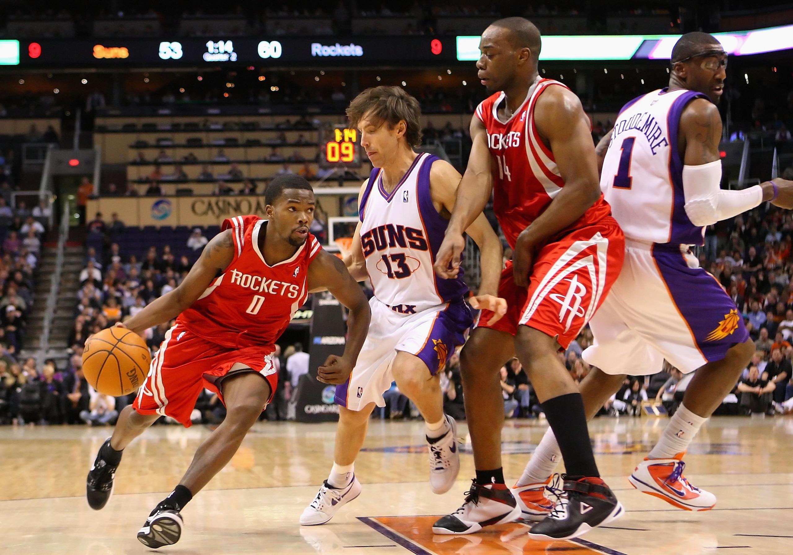 PHOENIX - JANUARY 06:  Aaron Brooks #0 of the Houston Rockets drives the ball past Steve Nash #13 of the Phoenix Suns during the NBA game at US Airways Center on January 6, 2010 in Phoenix, Arizona. The Suns defeated the Rockets 118-110.  NOTE TO USER: Us