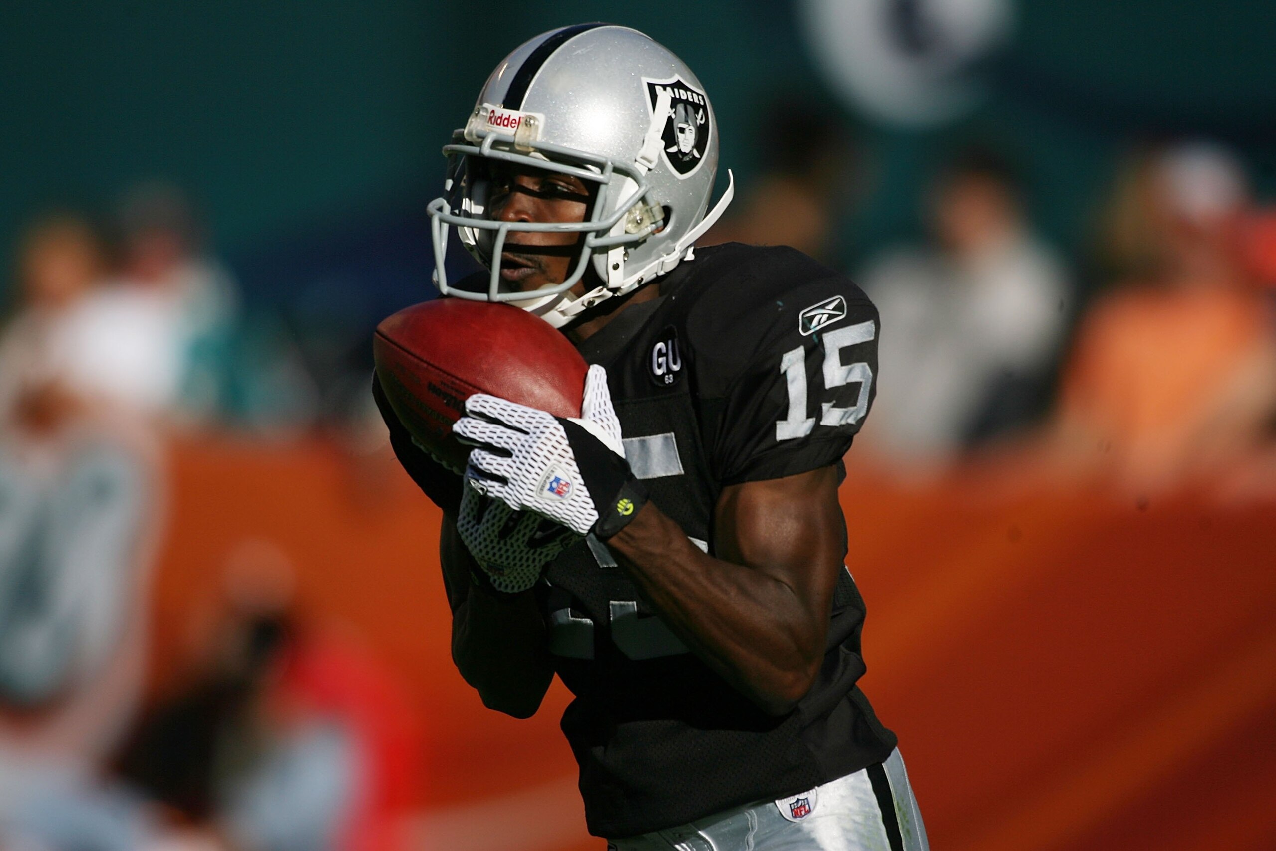 MIAMI - NOVEMBER 16:  Receiver Johnny Lee Higgins #15 of the Oakland Raiders returns a punt against the Miami Dolphins in the second quarter on November 16, 2008 at Dolphin Stadium in Miami, Florida. The Dolphins defeated the Raiders 17-15.  (Photo by Mar